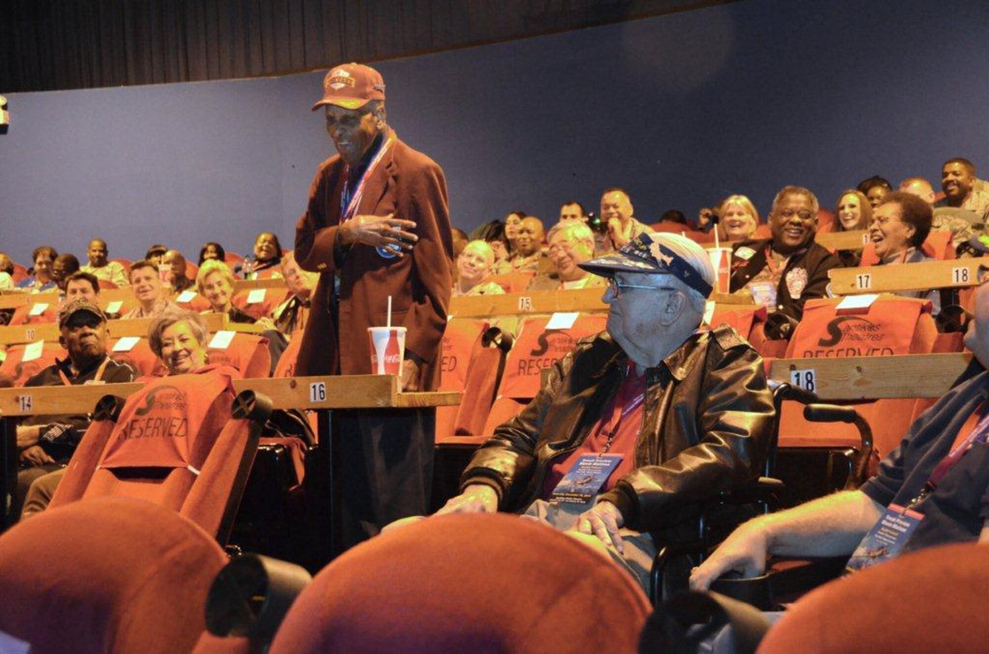 Documented Original Tuskegee Airman, Dr. Granville Coggs talks to members of 
the audience during a question and answer session following a private 
screening of "Double Victory," as World War II veteran Lester Jung looks on. 
Jung was a B-17 pilot that was escorted by the Tuskegee Airmen during World 
War II. "I was always happy to see the P-51s with their red tails, they 
assured us good coverage while flying over enemy territory," said Jung. The 
event took place at the Santikos Rialto Theatre in San Antonio, Dec. 10. (U.S. Air Force photo/ Senior Master Sgt. Minnie Jones) 