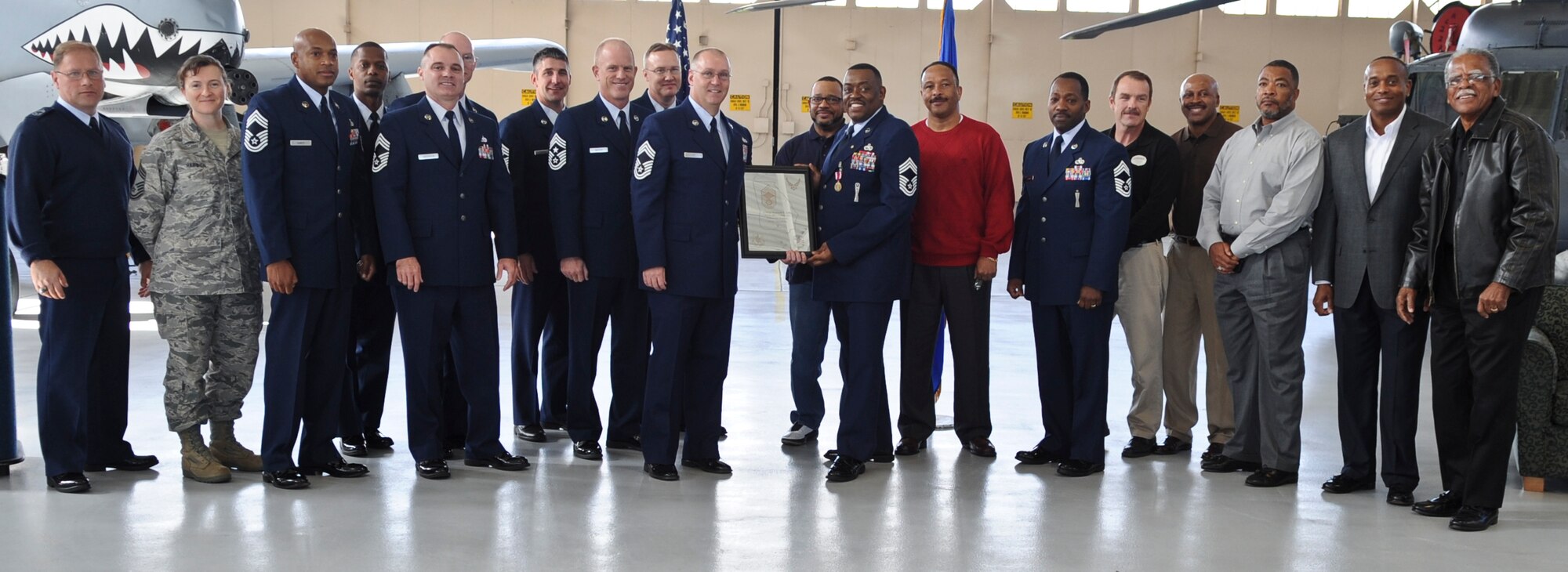 Chief Master Sgts. currently serving and that have served with Chief Master Sgt. Kenneth Lilly, take a group photograph during his retirement ceremony at Moody Air Force Base, Ga., Dec. 19, 2011. Many Airmen came to support Lilly to honor his achievements throughout his 30 year career. (U.S. Air Force photo by Airman 1st Class Olivia Dominique/Released)