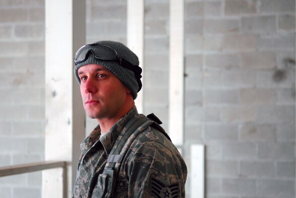 Prior to deploying in support of the POMLT 4 mission, members of the 171st Security Forces Squadron perform weapon qualification on the M-4 rifle and M-9 pistol. A police operational mentor and liaison team, POMLT4 will spend the next year training and teaching Afghan military and police on security tactics in Afghanistan. (National Guard photo by Tech. Sgt. Stacy Gault)