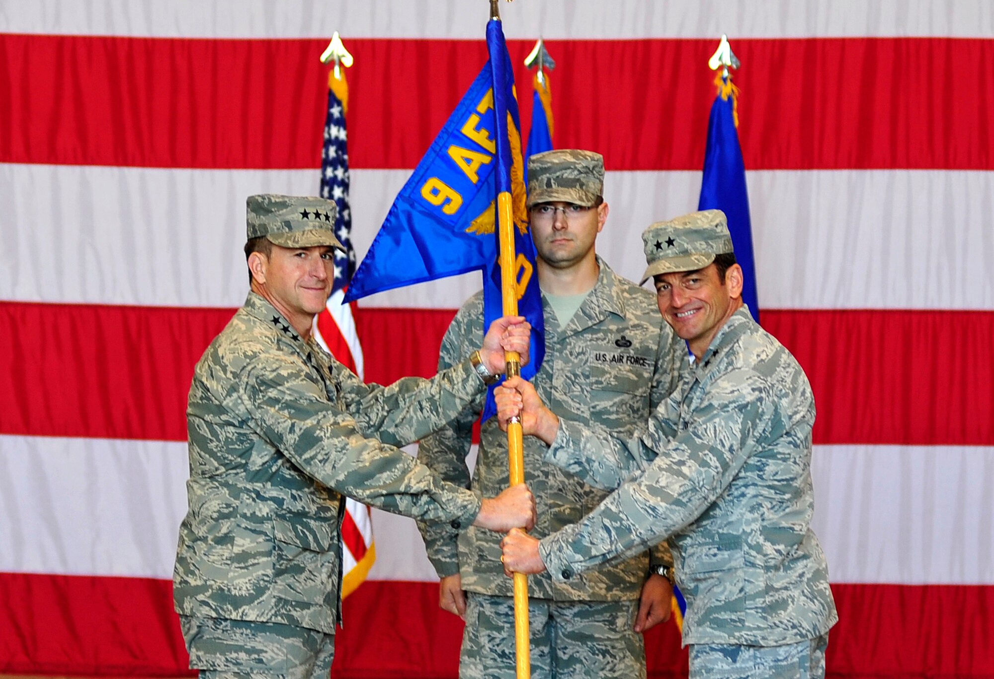 Lt. Gen. David Goldfien (left), commander U.S. Air Forces Central Command, and Maj. Gen. Russ Handy, commander, 9th Air and Space Expeditionary Task Force-Iraq, inactivate the 9th AETF-I at an undisclosed location in Southwest Asia, Dec. 18, 2011.  The ceremony took place hours after the last remaining U.S.military forces drove across the Iraqi border per the Iraq and U.S. 2008 Security Agreement that required all U.S. service members to be out of the country by  Dec. 31 . Since 2003, more than 1 million Airmen, Soldiers, Sailors and Marines have served in Iraq. (U.S. Air Force photo/Master Sgt. Cecilio Ricardo)