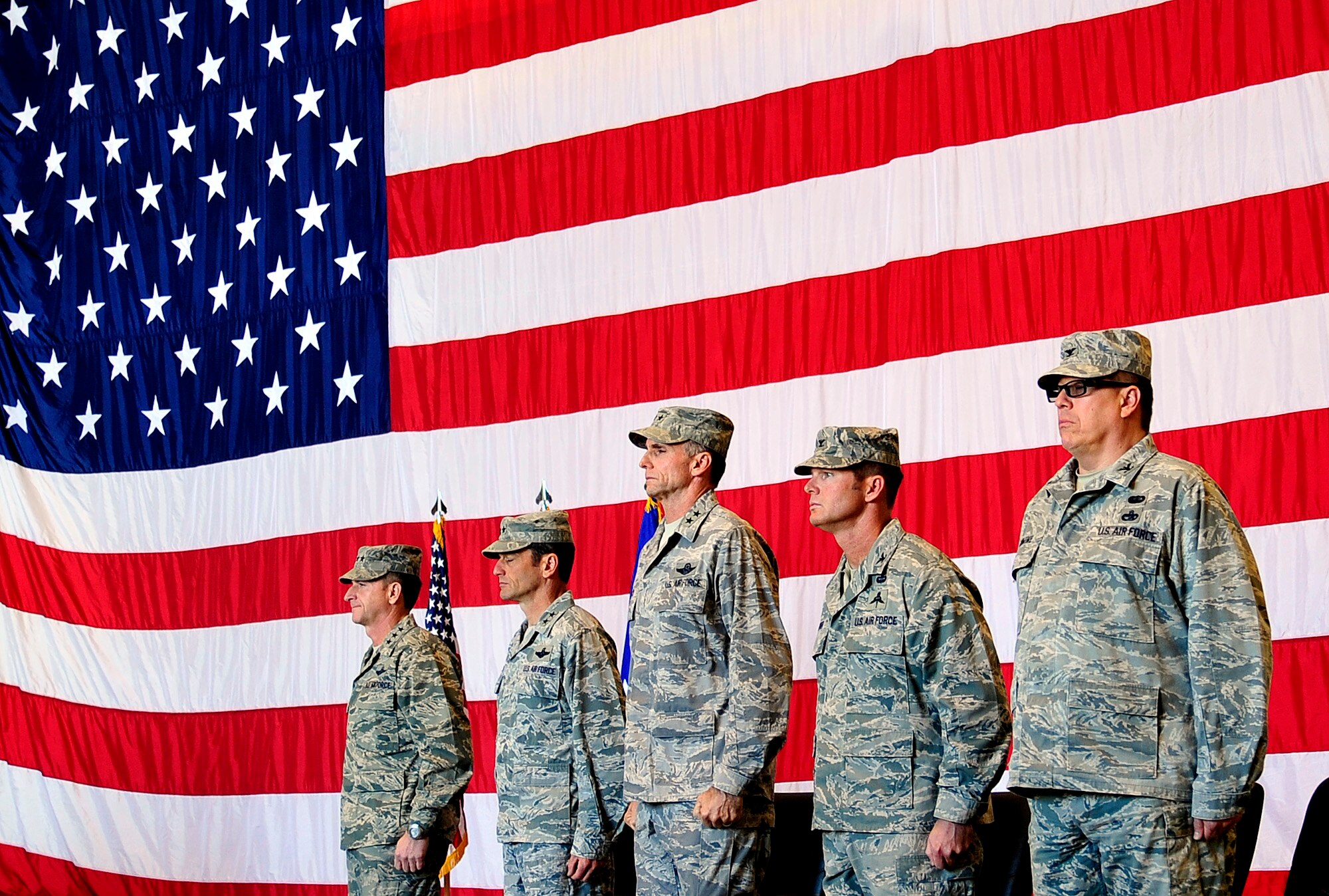 Lt. Gen. David Goldfein (left), commander U.S. Air Forces Central Command, Maj. Gen. Russ Handy, commander, 9th Air and Space Expeditionary Task Force-Iraq, Maj. Gen. Anthony Rock, commander 321st Air Expeditionary Wing, Col. Claude Tudor, commander, 368th Expeditionary Air Support Operations Group, and Col. Ralph Romine, commander, 467th Air Expeditionary Group, stand at attention during the posting of the colors during the in activation ceremony of the 9th AETF-I, 321st AEW, 467th AEG,  and the 368th AESG at an undisclosed location in Southwest Asia, Dec. 18, 2011.  The ceremony took place hours after the last remaining U.S.military forces drove across the Iraqi border per the Iraq and U.S. 2008 Security Agreement that required all U.S. service members to be out of the country by  Dec. 31 . Since 2003, more than 1 million Airmen, Soldiers, Sailors and Marines have served in Iraq. (U.S. Air Force photo/Master Sgt. Cecilio Ricardo)
