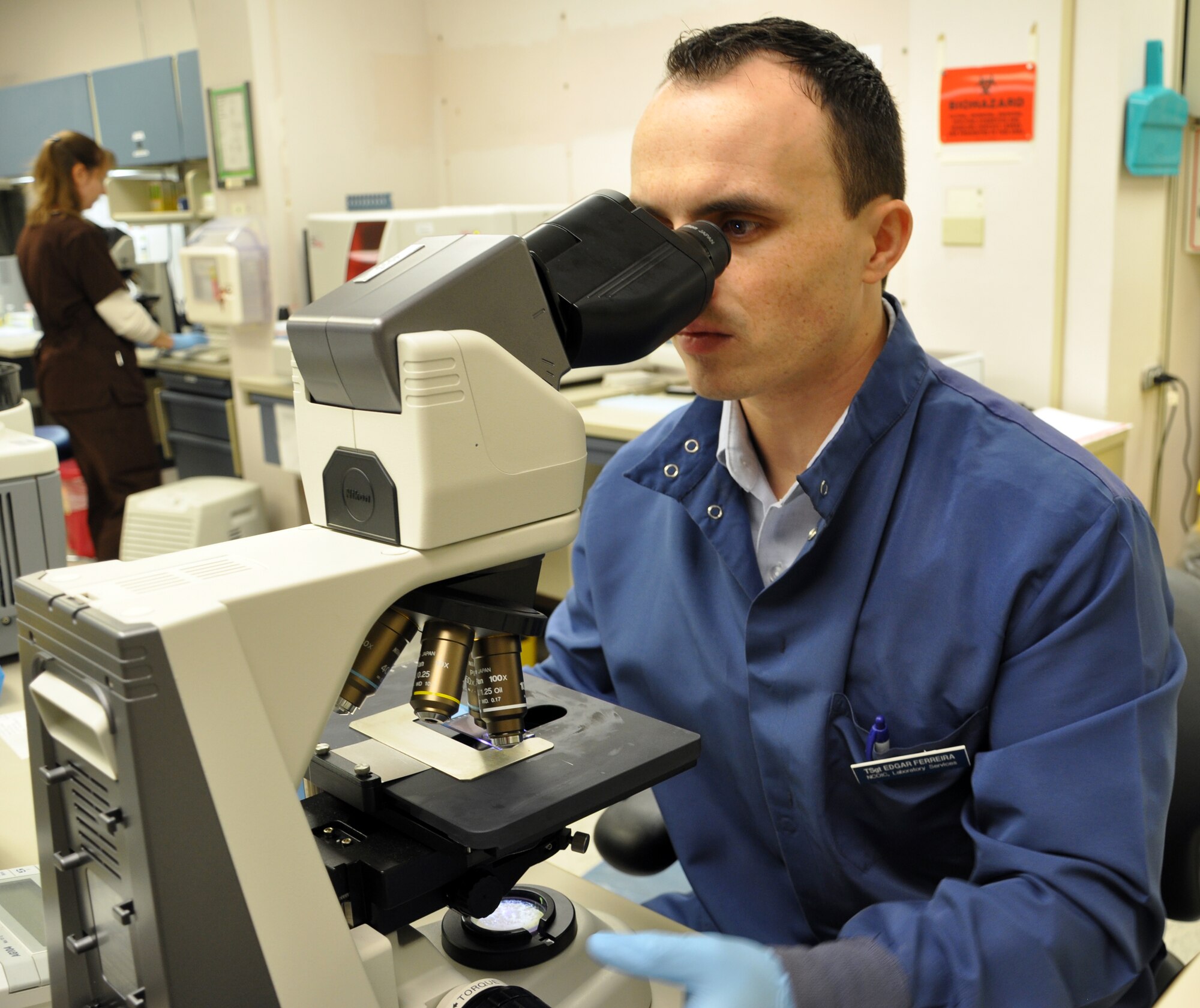 LAUGHLIN AIR FORCE BASE, Texas— Tech. Sgt. Edgar Ferreira, 47th Medical Support Squadron NCO in-charge of laboratory services, conducts lab work here Dec. 19. Ferreira was the victim of a drunk driver Dec. 7, 2007, an event that left him with a compound femur fracture and two broken knee caps which he has made a full recovery from. (U.S. Air Force photo/2nd Lt. James Ramirez)