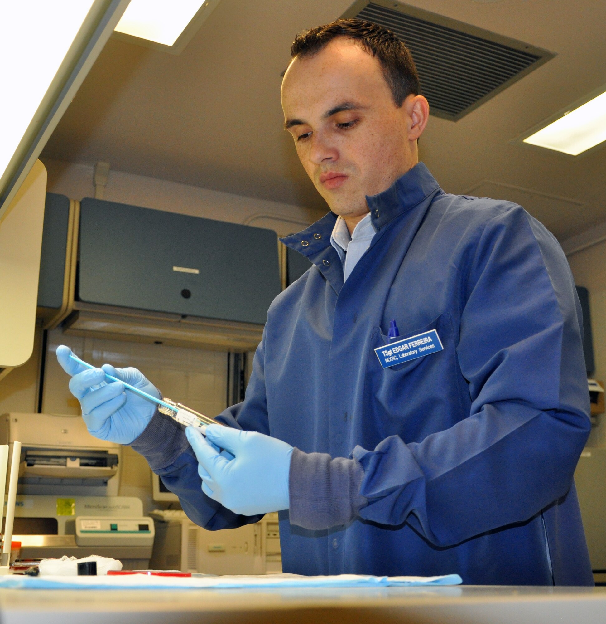 LAUGHLIN AIR FORCE BASE, Texas— Tech. Sgt. Edgar Ferreira, 47th Medical Support Squadron NCO in-charge of laboratory services, conducts lab work in a microbiology laboratory here Dec. 19. Ferreira was the victim of a drunk driver Dec. 7, 2007, an event that left him with a compound femur fracture and two broken knee caps which he has made a full recovery from. (U.S. Air Force photo/2nd Lt. James Ramirez)