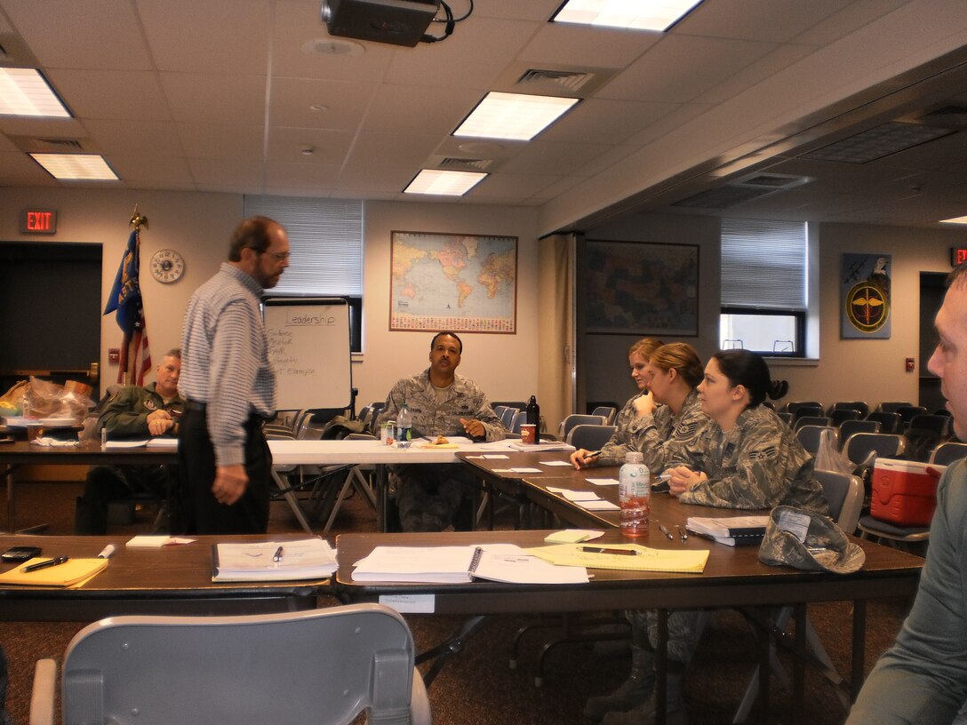AFRC AFSO 21 Mentor Dr. Doug Ferguson gives guidence to 914th Airmen as they conduct  their initial AFSO 21 Green Belt Training, here at the Niagara Falls Air Reserve Station. This training gives the Airmen generic tools and guidelines that can translate across the spectrum of career fields