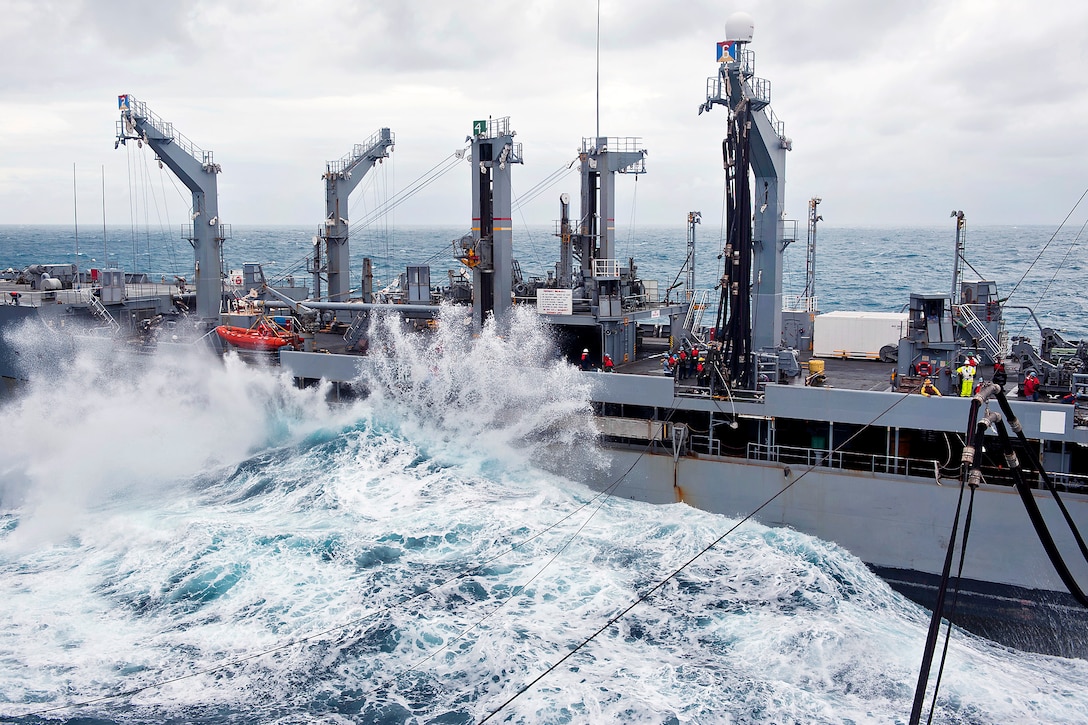 Heavy waves crash against the USNS Tippecanoe during a replenishment-at-sea mission with the USS Makin Island under way in the Pacific Ocean, Dec. 20, 2011. 