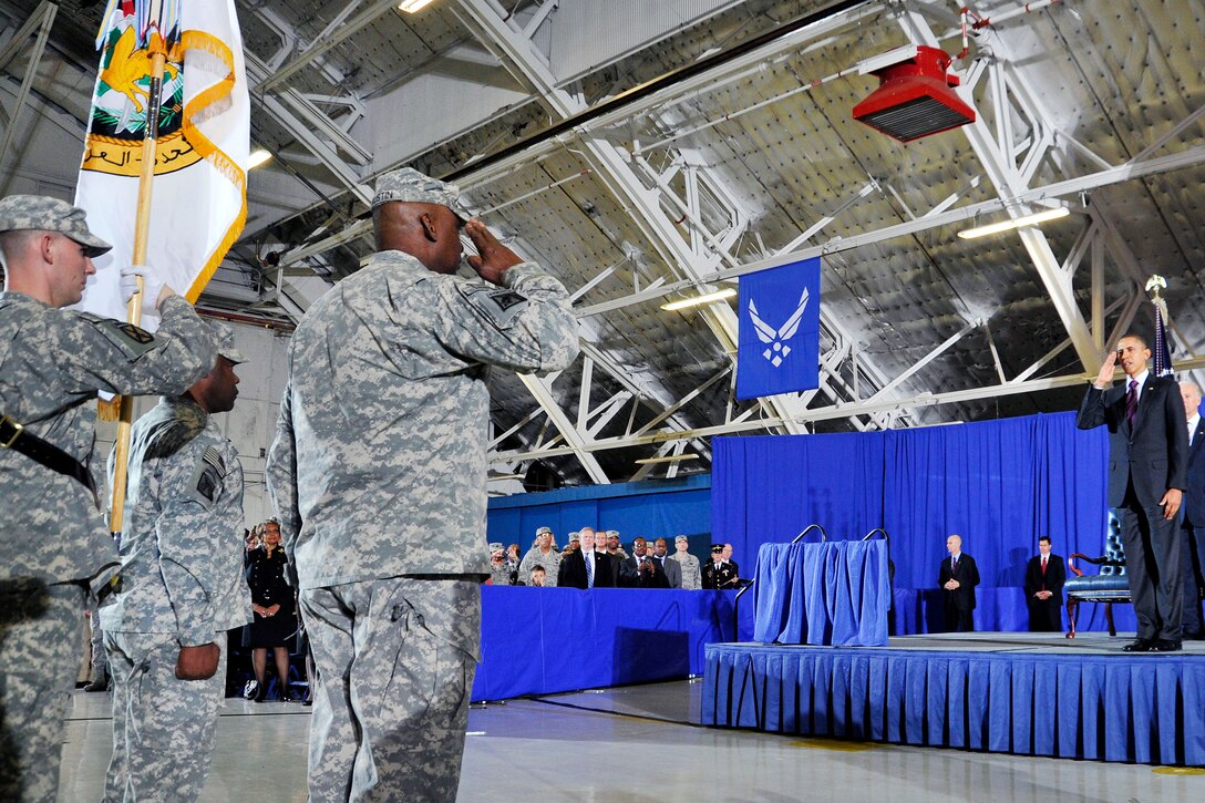 Army Gen. Lloyd J. Austin III salutes President Barack Obama during the playing of the national anthem as part of a ceremony to retire the colors from the U.S. military mission in Iraq on Joint Base Andrews, Md., Dec. 20, 2011.
