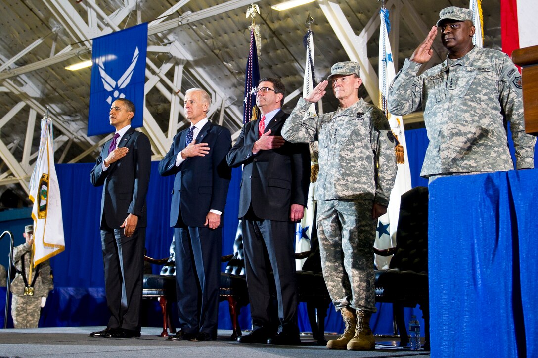 From left, President Barack Obama, Vice President Joe Biden, Deputy Defense Secretary Ashton B. Carter, Army Gen. Martin E. Dempsey, chairman of the Joint Chiefs of Staff, and Army Gen. Lloyd J. Austin III, the last commander of U.S. Forces Iraq, salute as the national plays during a ceremony to retire colors from the U.S. Iraq mission on Joint Base Andrews, Md., Dec. 20, 2011.