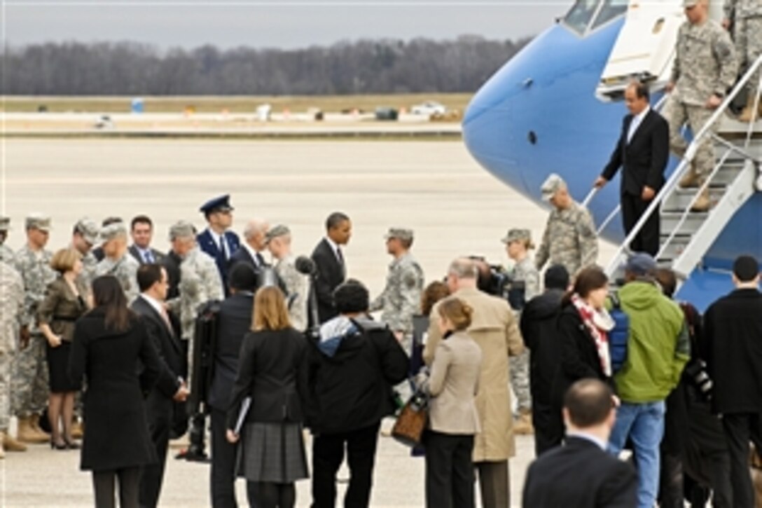 President Barack Obama greets the last troops assigned to U.S. Forces Iraq as they arrive on Joint Base Andrews, Md., Dec. 20, 2011.