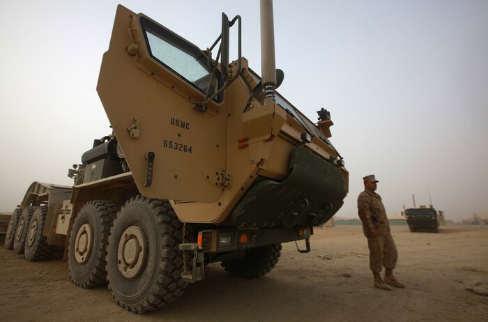 Cpl. Kory Frens, of Grant, Mich., awaits the arrival of his students during a licensing course for the Logistics System Vehicle Replacement 16 Tractor aboard Camp Leatherneck, Dec. 21. Frens, along with other personnel attached to the 2nd Marine Logistics Group (Forward), has spent the last week introducing Marines to the new asset and educating them on the robust set of capabilities it offers. (U.S. Marine Corps photo by Sgt. Justin J. Shemanski)