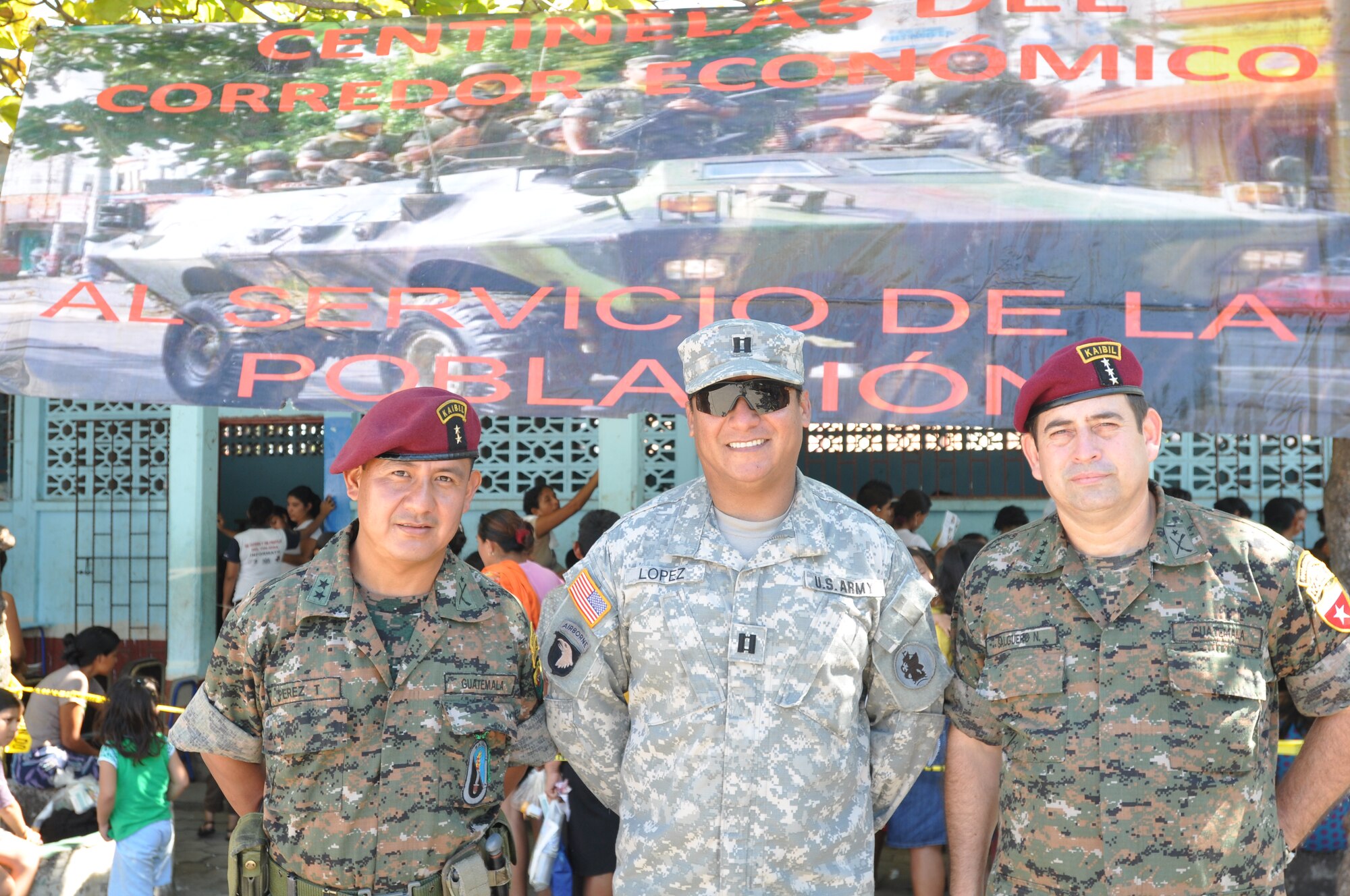 Capt. Sergio Lopez (center), the Army Forces executive officer, Soto Cano Air Base, Honduras, poses with Col Salguero (left) and Lt. Col. Salguero (right), both members of the 4th Infantry Brigade in Champerico, Guatemala Dec. 12, 2011. The brigade hosted 22 Joint Task Force-Bravo members during the medical readiness and training exercise in El Codo and Champerico Dec. 8-13. During the MEDRETE, medical professionals provided care to more than 1,400 residents. (U.S. Air Force photo/Capt. Candice Allen)