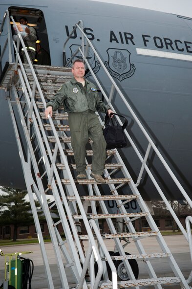Col. Paul Murphy, 305th Air Mobility Wing commander, originally from Boston, Mass., exits one of the 12 KC-10 Extenders after having piloted the aircraft during the ‘Elephant Walk’ exercise Dec. 20, 2011, at Joint Base McGuire-Dix-Lakehurst, N.J. An ‘Elephant Walk’ is a fundamental training element when preparing for Global Strike Missions. The ‘Elephant Walk’ is a display of air power showcasing the 305th AMW’s contributions to Air Mobility Command. (U.S. Air Force photo by Russell Meseroll/Released)