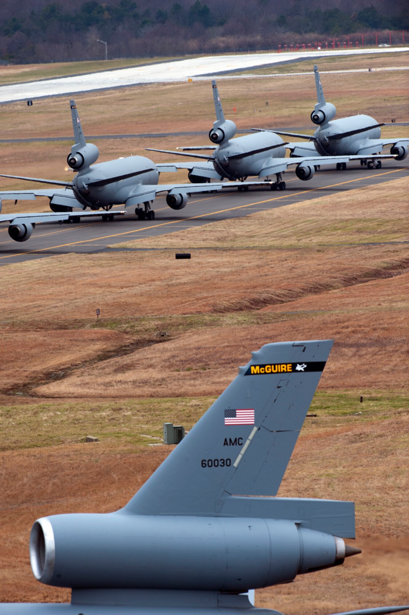Eight KC-10 Extenders taxi out to the runway Dec. 20 here in preparation for an ‘Elephant Walk’ exercise. An ‘Elephant Walk’ is a fundamental training element when preparing for Global Strike Missions. This was the first ‘Elephant Walk’ in nearly five years, with the 305th Air Mobility Wing launching all 12 KC-10 Extenders on the ramp, one right after the other, in a 30-minute time period. Members of the 32nd and 2nd Air Refueling Squadrons, as well as members from the 514th Air Mobility Wing, participated in the Employment Defense and Global Engagement exercise. (U.S. Air Force photo by Wayne Russell/Released)
