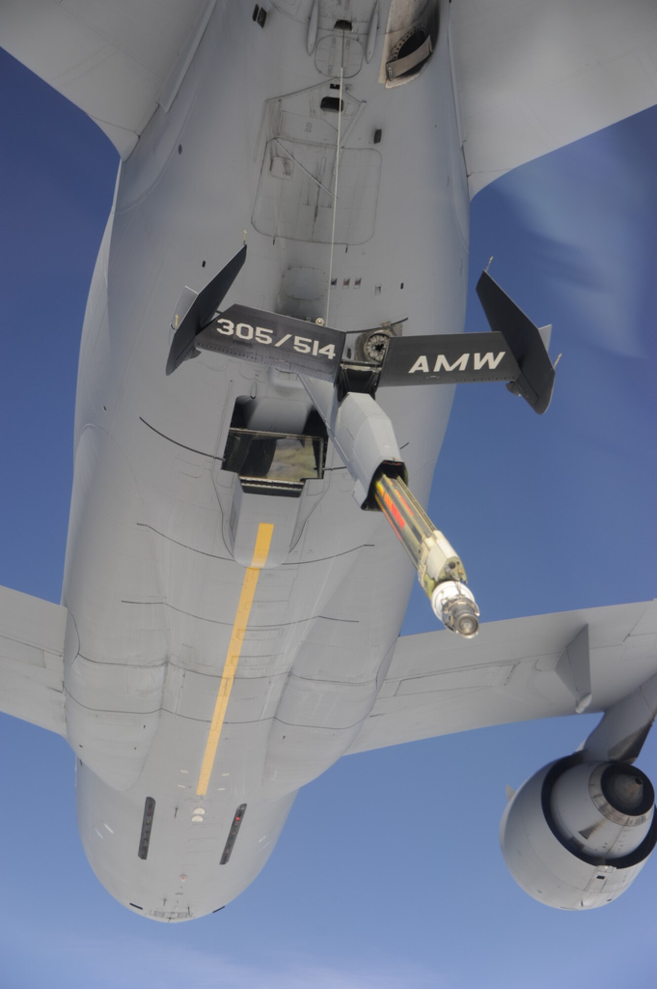 A KC-10 Extender lowers its refueling boom to another KC-10 to simulate the transfer of fuel during an ‘Elephant Walk’ exercise Dec. 20 here. Members of the 32nd and 2nd Air Refueling Squadrons as well as members of the 305th and 514th Air Mobility Wings participated in the Employment Defense and Global Engagement exercise, which included mass simultaneous aerial refueling of four KC-10s by four other KC-10s. In all, the exercise involved 12 KC-10s as part of a global strike package exercise designed to demonstrate the capability of the Air Force to assemble a large refueling force. (U.S. Air Force photo by 2nd Lt. David J. Murphy/Released)

