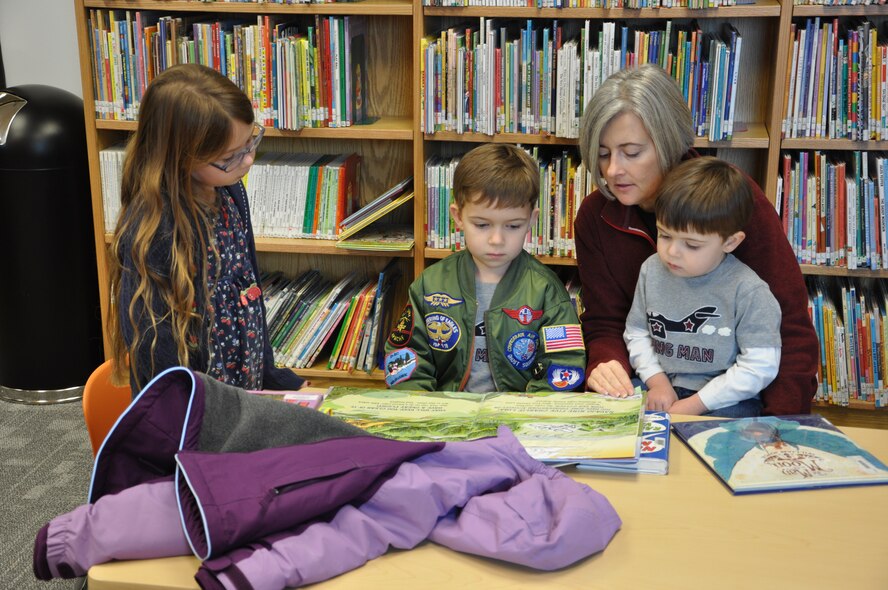LAUGHLIN AIR FORCE BASE, Texas—A group of kids enjoy reading books at the Laughlin library. The library opened in its new location in building 223 Dec. 20. (U.S. Air Force photo/2nd Lt. Angela Martin)