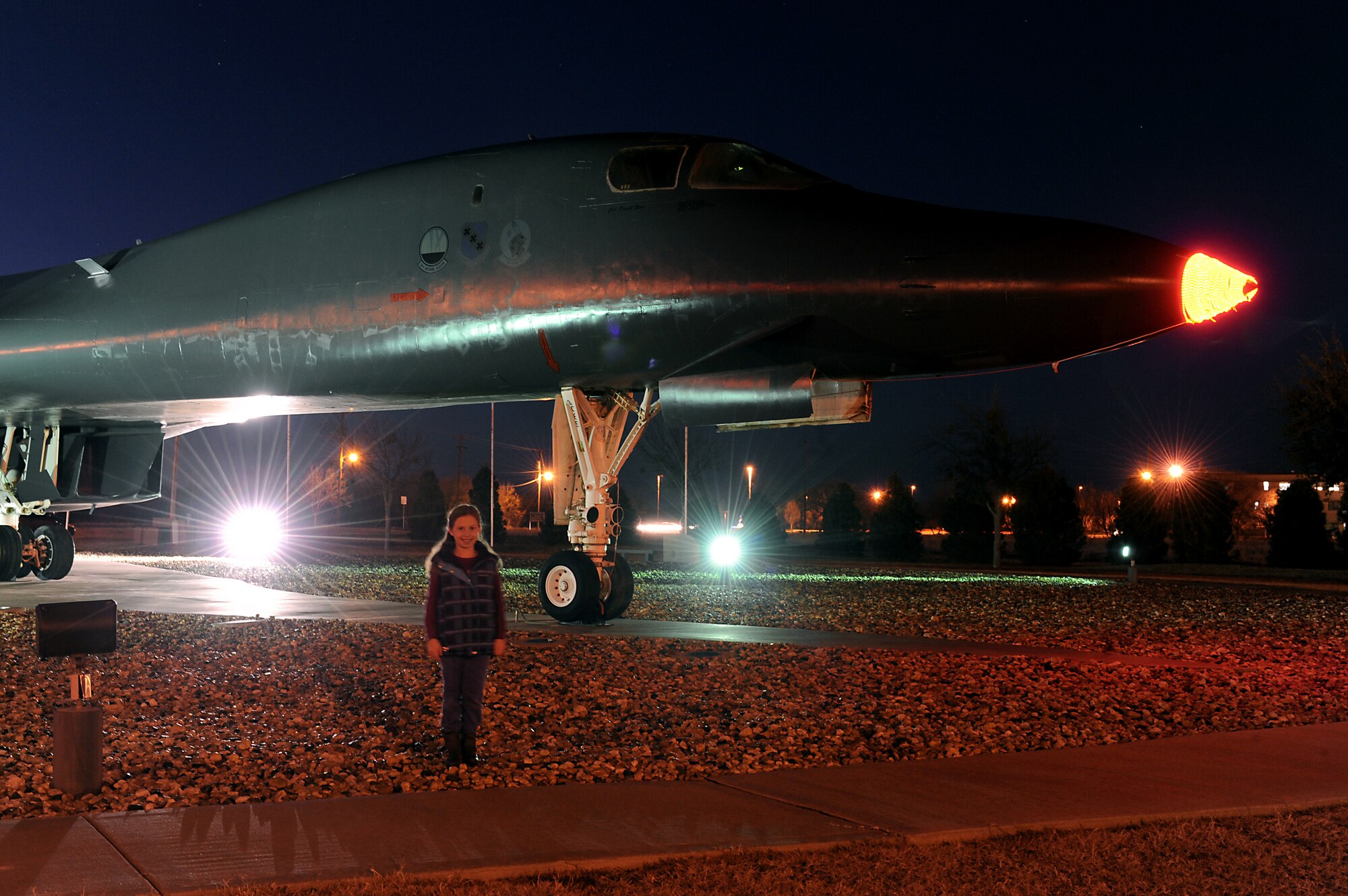 Julia Davidson poses in front of the static B-1 Bomber display which she and her father, Lt. Col. Robert Davidson, 7th Bomb Wing Inspector General, decorated with a Rudolph nose on Dec. 20, 2011 at Dyess Air Force Base, Texas.