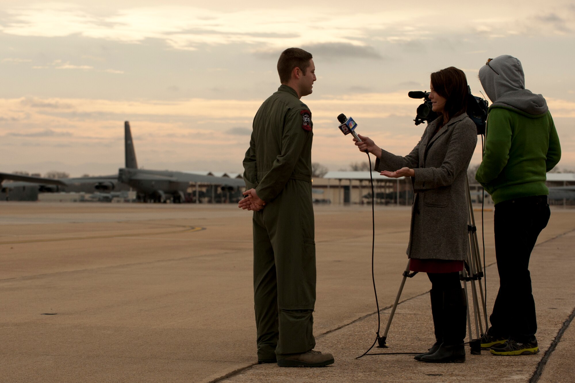 U.S. Air Force 2nd Lt. Ryan Brookins, 11th Bomb Squadron electronic warfare officer, is interviewed by KTAL Channel 6 news reporter Leslie Draffin for a Barksdale Profile segment, Barksdale Air Force Base, La., Dec. 21, 2011. The segment focused on Brookins and two other members of class 11-03 who have finished a B-52 aircrew training school with the 93rd Bomb Squadron. (U.S. Air Force photo by Master Sgt. Greg Steele/Released)