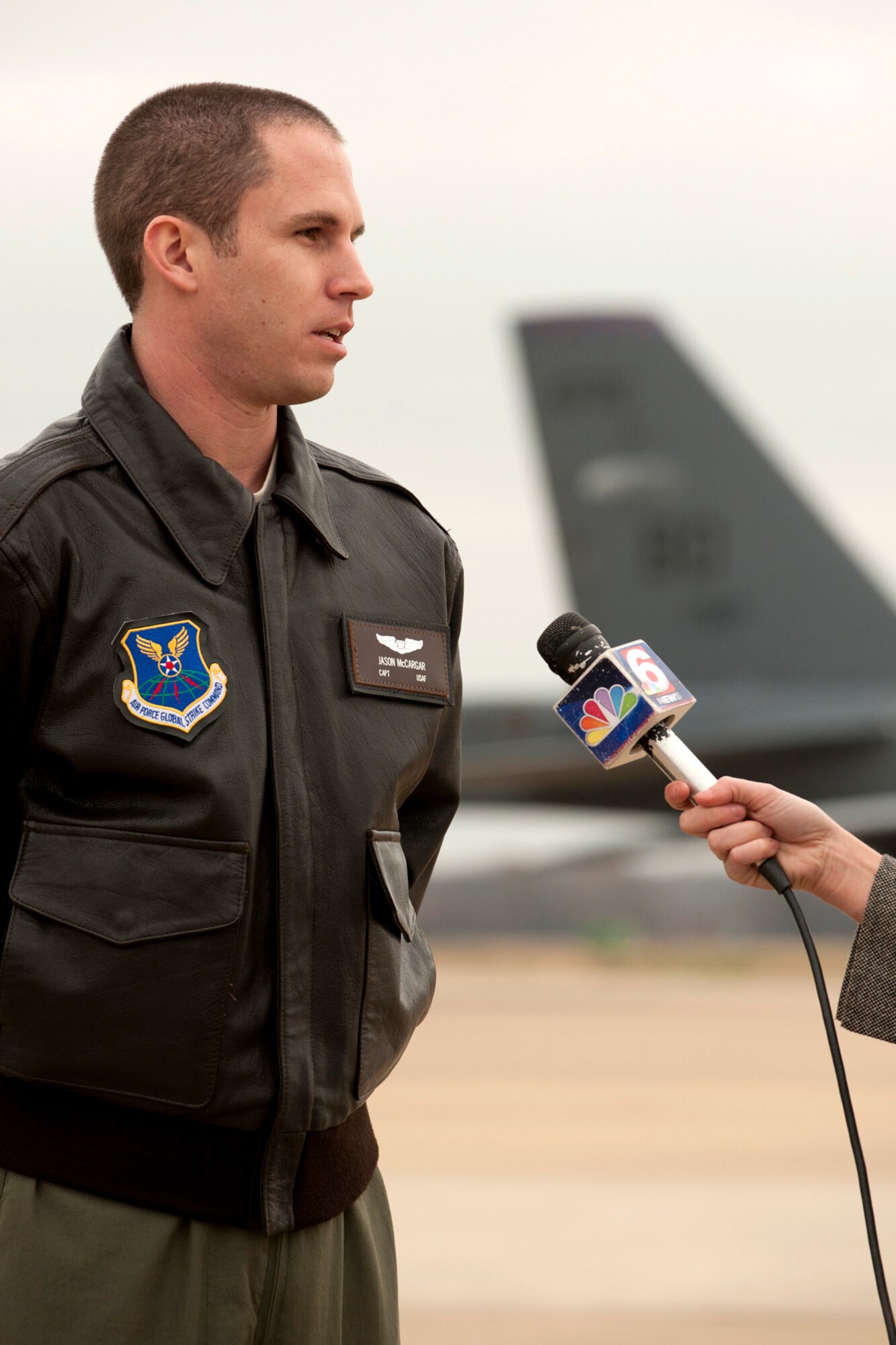 U.S. Air Force Capt. Jason McCargar, 11th Bomb Squadron navigator, is interviewed by a KTAL Channel 6 news reporter for a Barksdale Profile segment, Barksdale Air Force Base, La., Dec. 21, 2011. McCargar just completed the B-52 aircrew training with the 93rd Bomb Squadron. (U.S. Air Force photo by Master Sgt. Greg Steele/Released)