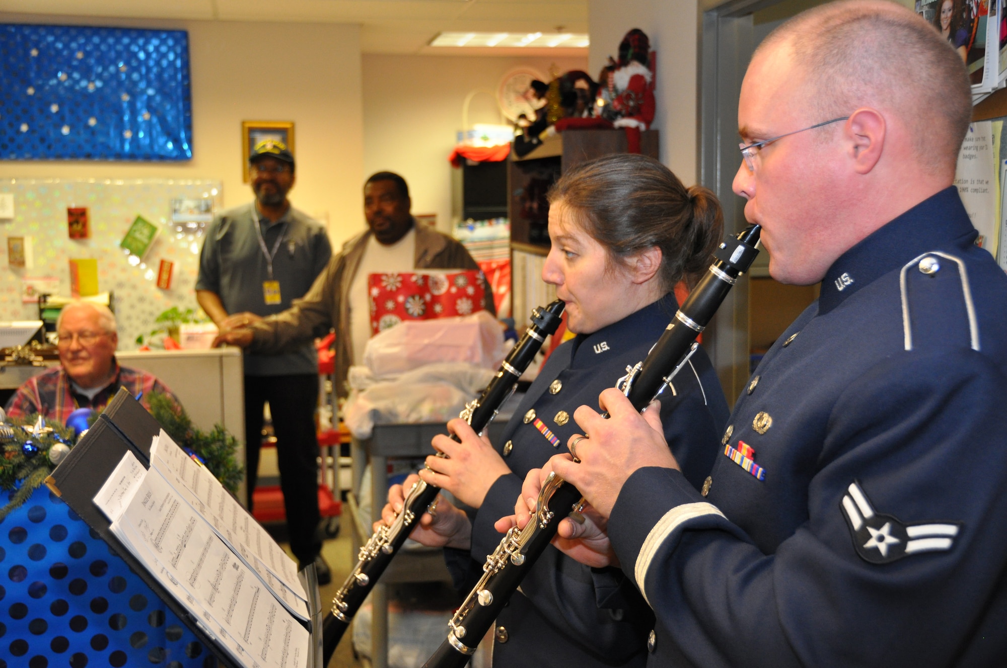 Airman 1st Class Joe Philpott (right) and Airman 1st Class Charlan Mueller play for the volunteers at the Atlanta Veterans Administration Medical Center Dec. 15.  The ensemble was part of the Band of the U.S. Air Force Reserve’s two-day, four medical center caroling tour to bring holiday cheer to veterans in Alabama and Georgia. (U.S. Air Force photo/Peter Chadwick)