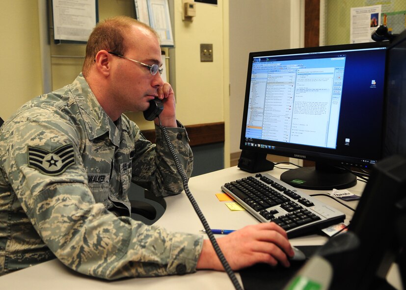 Staff Sgt. Carys Cloudwalker, 9th Communications Squadron NCO in charge of the Communications Focal Point, troubleshoots a help desk ticket for a commander Dec. 21, 2011. Cloudwalker and other Comm. Airmen can remote into other computer, enabling them to solve issues without dispatching a technician. (U.S. Air Force photo by Senior Airman Shawn Nickel/Released)