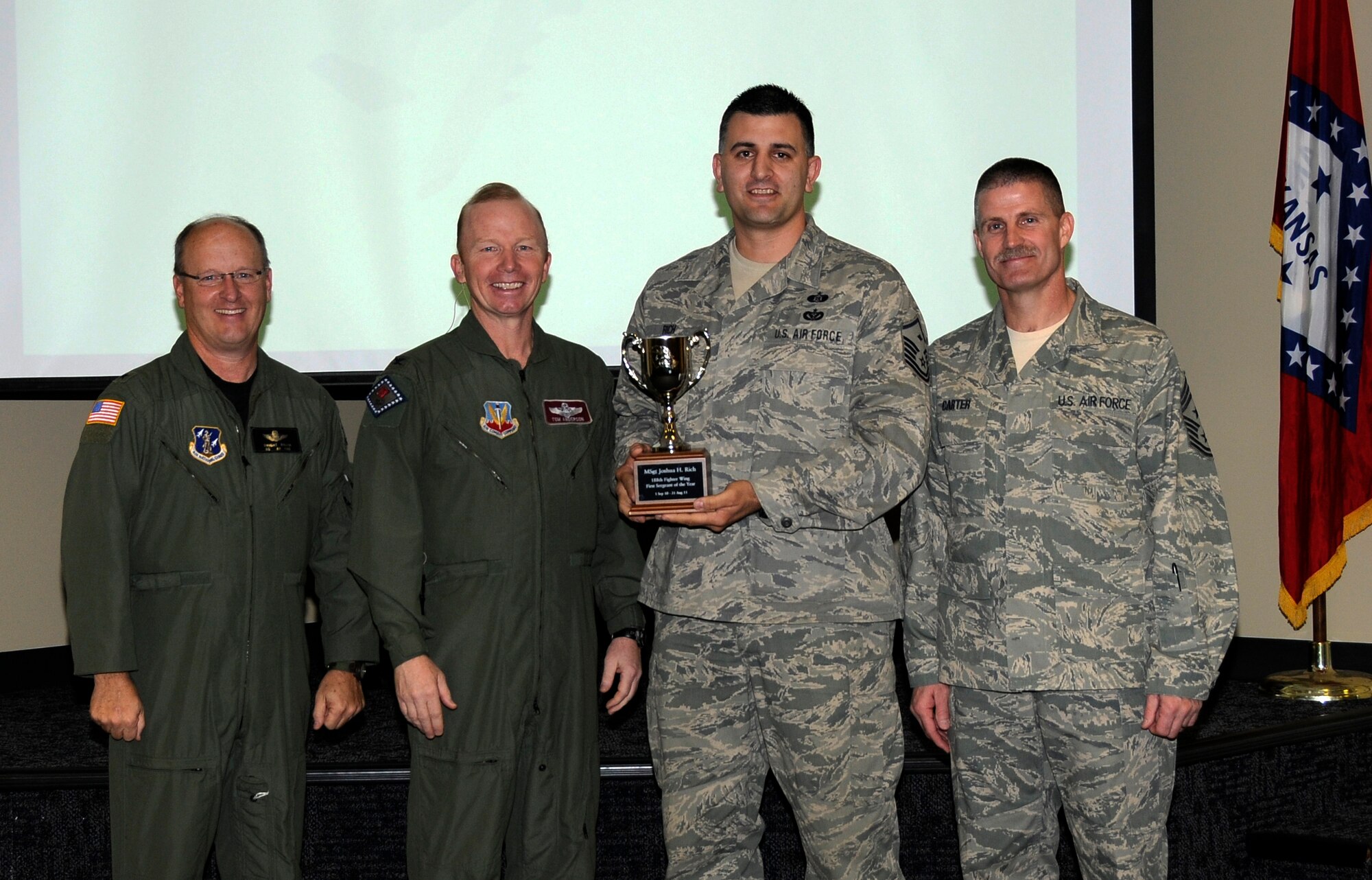 From left: Brig. Gen. Dwight Balch, Arkansas Air National Guard commander; Col. Tom Anderson, 188th Fighter Wing commander; Master Sgt. Joshua Rich; and Chief Master Sgt. Asa Carter, 188th command chief. Rich, a member of the 188th Civil Engineer Squadron, was named the 188th’s Outstanding First Sergeant of the Year during a commander’s call Dec. 3. (U.S. Air Force photo by Airman 1st Class Hannah Landeros/188th Fighter Wing Public Affairs)
