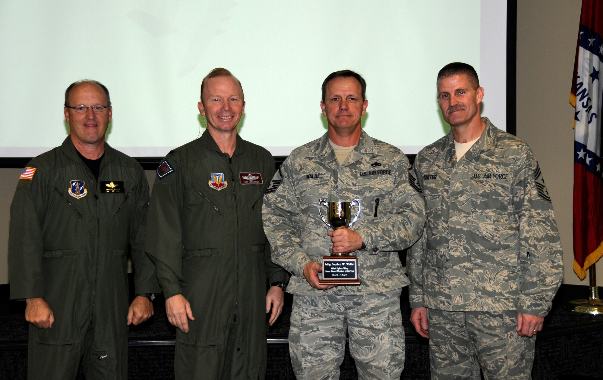 From left: Brig. Gen. Dwight Balch, Arkansas Air National Guard commander; Col. Tom Anderson, 188th Fighter Wing commander; Master Sgt. Stephen Walbe; and Chief Master Sgt. Asa Carter, 188th command chief. Walbe was named the 188th’s Outstanding Honor Guard Member of the Year during a commander’s call Dec. 3. (U.S. Air Force photo by Airman 1st Class Hannah Landeros/188th Fighter Wing Public Affairs)