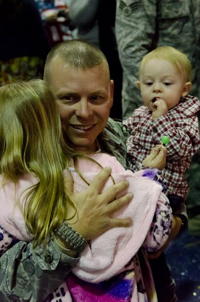 Airmen from the 139th Security Forces Squadron are greeted by family members at the Kansas City International Airport Dec. 20, 2011. The unit was deployed for six months to Iraq. (Missouri Air National Guard photo by Senior Airman Kelsey Stuart)