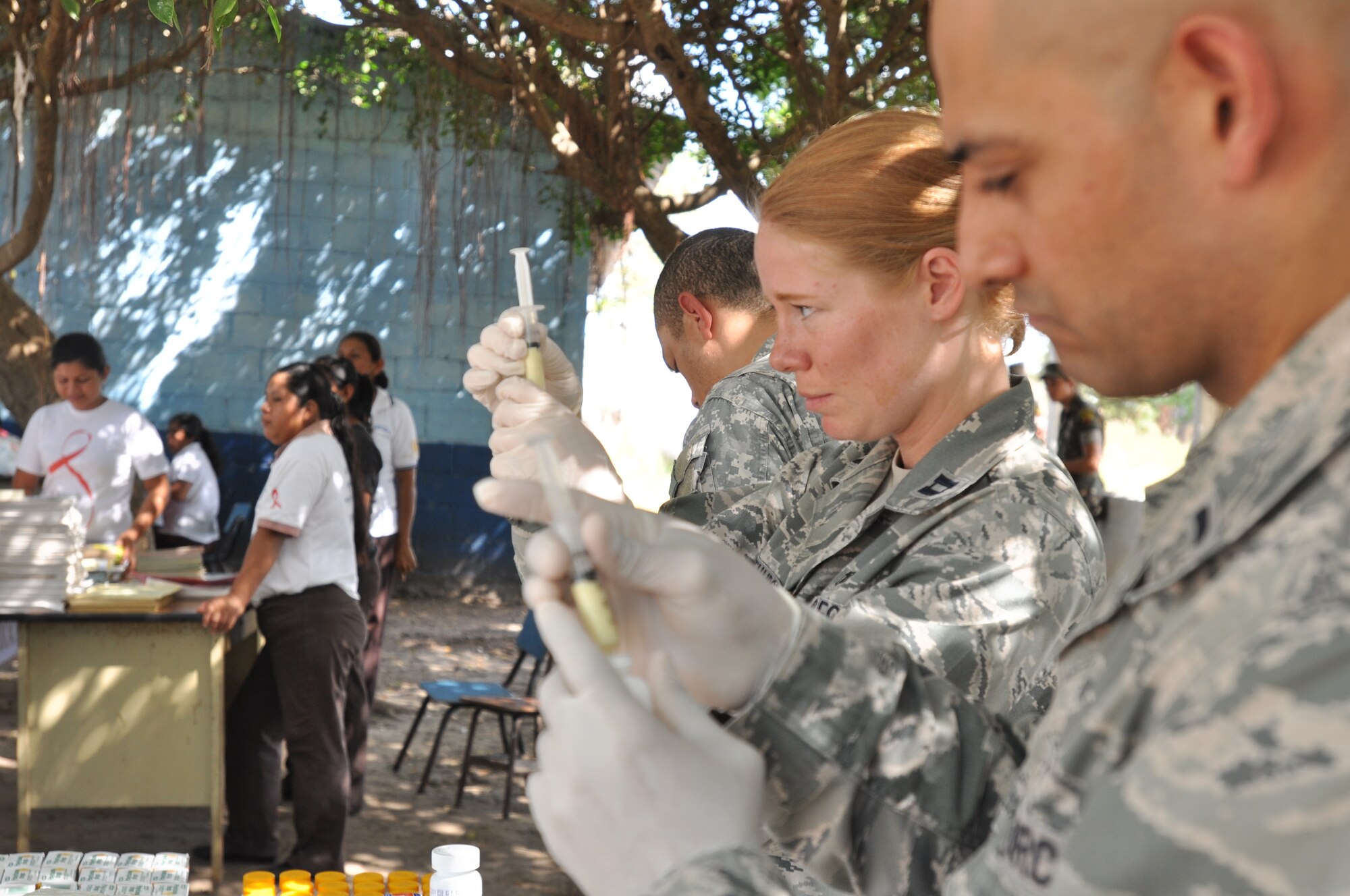 1st Lt. Mario Torres, a MEDEL admin officer, Capt. Katie Whitehurst, the officer-in-charge of preventive medicine, and Staff Sgt. Kevin Cook, a MEDEL food inspector, prepare medicine kits for patients during the medical readiness and training exercise in El Codo Dec. 9, 2011.  Twenty-two members from Joint Task Force-Bravo provided medical care to more than 1,400 residents Dec. 8-13 in an isolated region of southwest Guatemala.  In fiscal year 2011, JTF-Bravo medical members conducted 15 MEDRETES treating more than 41,000 patients throughout Central America. (U.S. Air Force photo/Capt. Candice Allen)