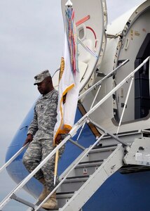United States Forces - Iraq Command Sgt. Maj. Joseph R. Allen carries the USF-I colors back onto U.S. soil at Joint Base Andrews, Md., Dec. 20. The Ceremony marks the end of the second longest war in U.S. history. (U.S. Air Force photo/ Senior Airman Perry Aston)