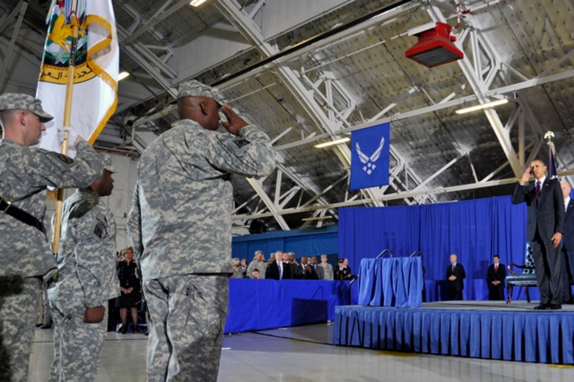 Gen. Lloyd J. Austin, III and Command Sgt. Maj Joseph R. Allen salute during the return the United States Forces - Iraq colors to the U.S., Dec 20, at Joint Base Andrews, Md. The Ceremony marks the end of the 2nd longest war in U.S. History. (U.S. Air Force Photo/Senior Airman Perry Aston) 