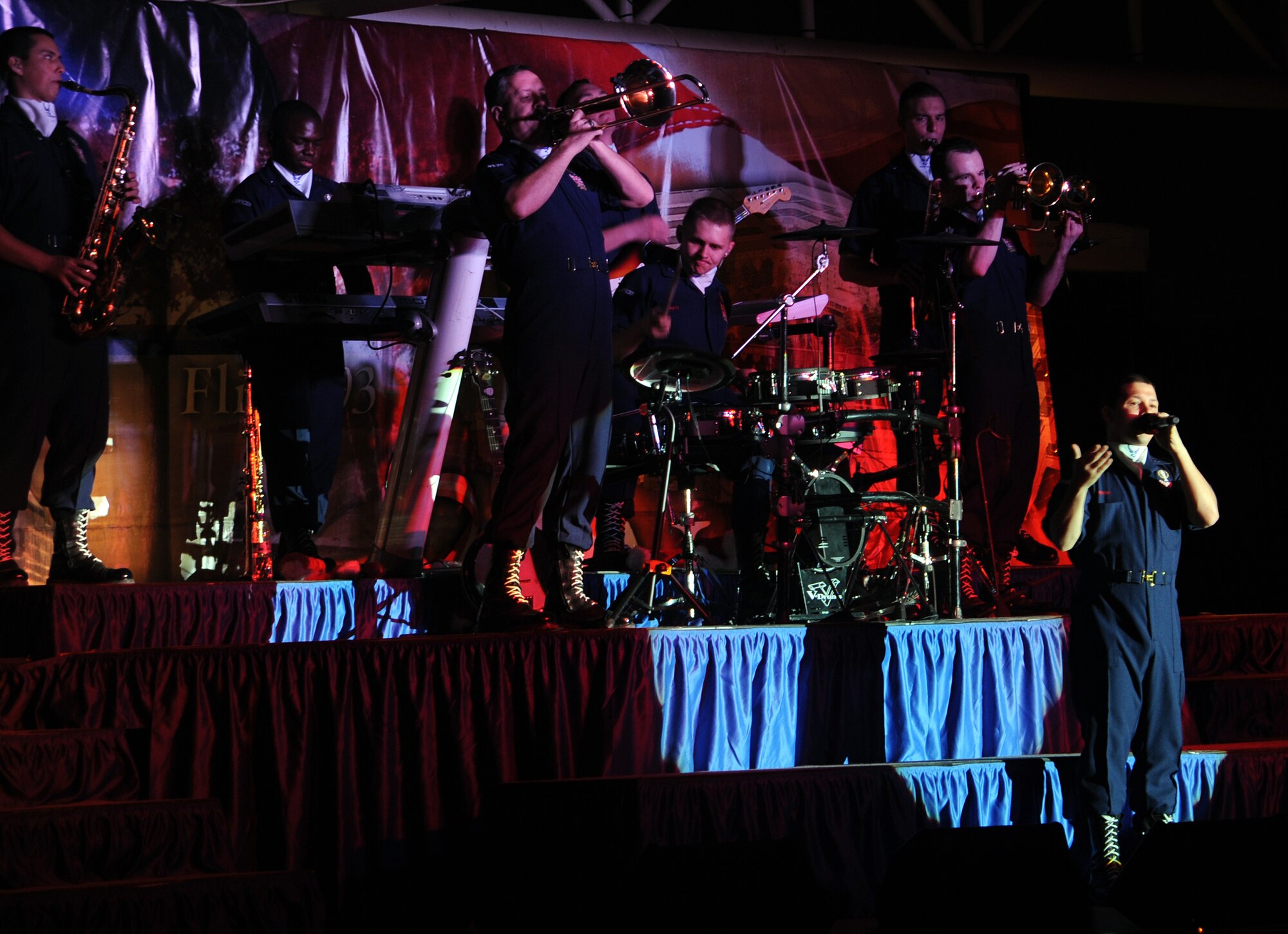 SOUTHWEST ASIA - Members of the Air Force entertainment group Tops in Blue perform at the community activity center pavilion Dec. 21, 2001. While here, the troupe performed three shows for 380th Air Expeditionary Wing Airmen, including one in the middle of the night at the aerospace ground equipment hangar near the flightline. After their final performance here, Tops in Blue takes its show on the road to several other installations in Southwest Asia. During the year, Tops in Blue performs about 150 shows, with 25-30 of them at deployed locations. (U.S. Air Force photo/Staff Sgt. J.G. Buzanowski)