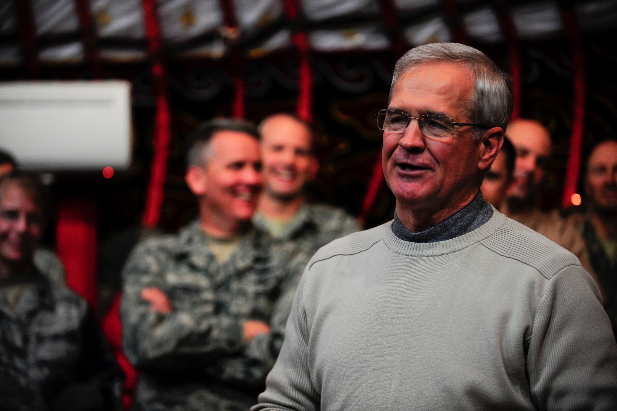 Retired Lt. Gen. Christopher Kelly talks to leadership of the 376th Expeditionary Wing and distinguished guests Dec. 20, 2011, at the Transit Center at Manas, Kyrgyzstan. Kelly was the first commander of the 376th AEW in 2001, and returned to celebrate the 376th AEW's 10th anniversary in Kyrgyzstan. (U.S. Air Force photo/Staff Sgt. Angela Ruiz)