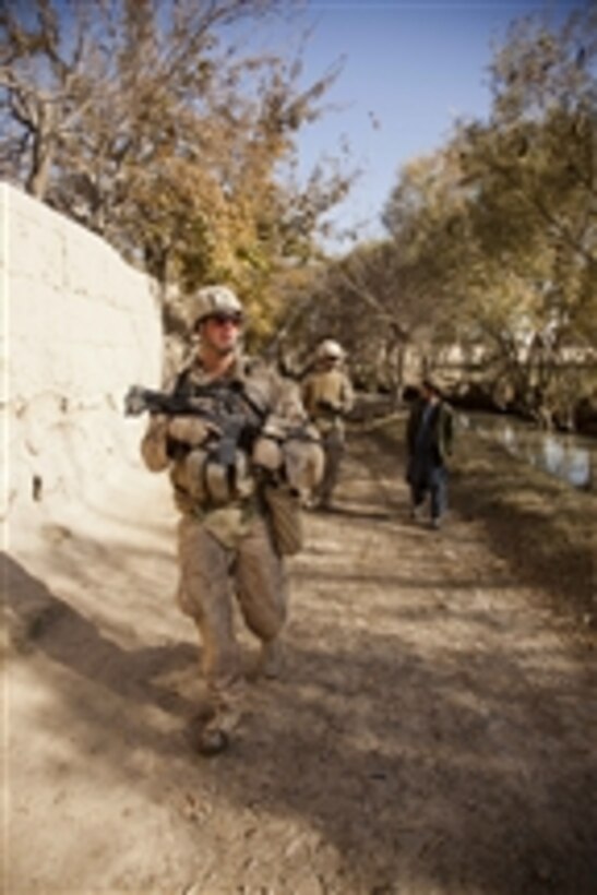 U.S. Marine Corps Cpl. David A. Mackay with India Company, 3rd Battalion, 7th Marines, Regimental Combat Team 8, conducts a security patrol in Sangin, Afghanistan, on Dec. 8, 2011.  The patrols help to maintain safety in the surrounding areas.  DoD photo by Lance Cpl. Armando Mendoza, U.S. Marine Corps.  (Released)