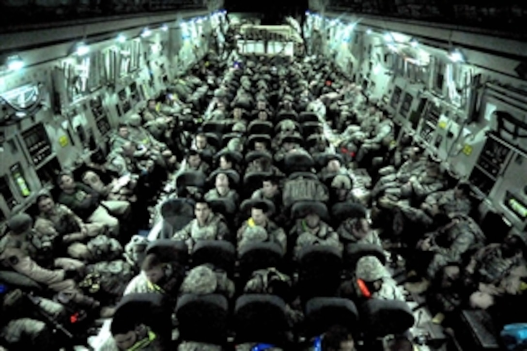 U.S. Air Force airmen prepare to take-off on a C-17 Globemaster III cargo aircraft at Ali Air Base, Iraq, signaling the end of Operation New Dawn on Dec. 18, 2011.  The airmen were part of the last troops to leave Iraq.  