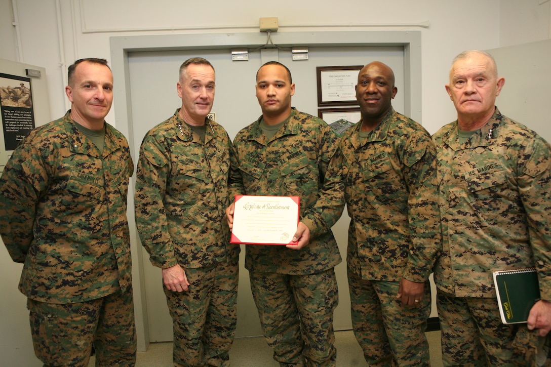 Corporal Joseph Lloyd, administrative clerk assigned to U.S. Marine Corps Forces, Europe reenlisted for four more years, by Assistant Commandant of the Marine Corps, Gen. Joseph F. ::r::::n::Dunford, during a recent trip to Stuttgart, Germany, en route to Afghanistan to spend Christmas with Marines and sailors deployed during the holiday season. Dunford stopped by every workspace at Marine Forces Europe and Africa headquarters to meet with Marines, sailors and civilians assigned there.  Lloyd poses after his reenlistment with: L to R - Brig. Gen. Charles Chiarotti, MFE/MFA deputy commanding general, ACMC, Gen. Joseph Dunford, Sgt. Maj. Ronald Green, MFE/MFA Sergeant Major and Lt. Gen. Dennis Hejlik, MFE commanding general.