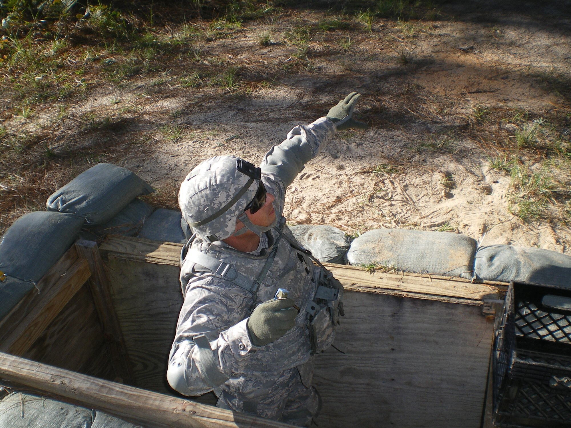 Capt. Chris Ianni, 14th Medical Support Squadron TRICARE Operations and Patient Administration Flight and Readiness Flight commander throws a grenade during deployment training. Capt. Ianni is currently deployed and serving as a Senior Medical Combat Advisor. (Courtesy photo)