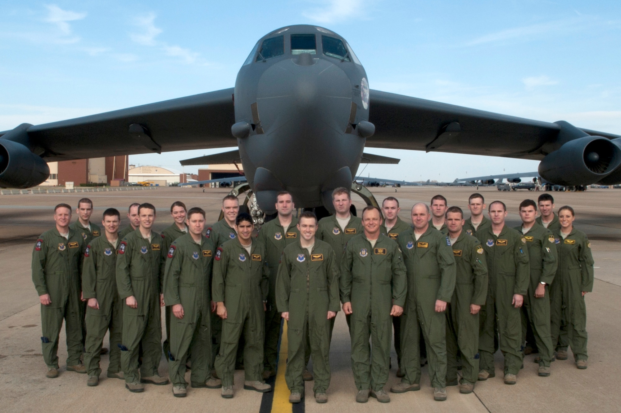 U.S. Air Force members of class 11-02 take a group photo in front of a B-52H Stratofortress, Barksdale Air Force Base, La., Dec. 19, 2011. The class graduated Dec. 22, 2011, after completing the B-52 aircrew training course with the 93rd Bomb Squadron Formal Training Unit, 307th Bomb Wing. (U.S. Air Force photo by Master Sgt. Greg Steele/Released)
