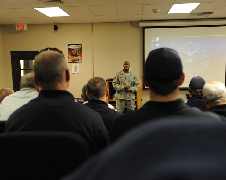 Master Sgt. Steven Woodard, 2nd Civil Engineer Squadron chief of fire training, briefs local firefighters about the hazards of aircraft fires on Barksdale Air Force Base, La., Dec. 20. When fighting aircraft fires, emergency responders need to be able to identify the aircraft's munitions systems. (U.S. Air Force photo/Airman 1st Class Micaiah Anthony)(RELEASED)