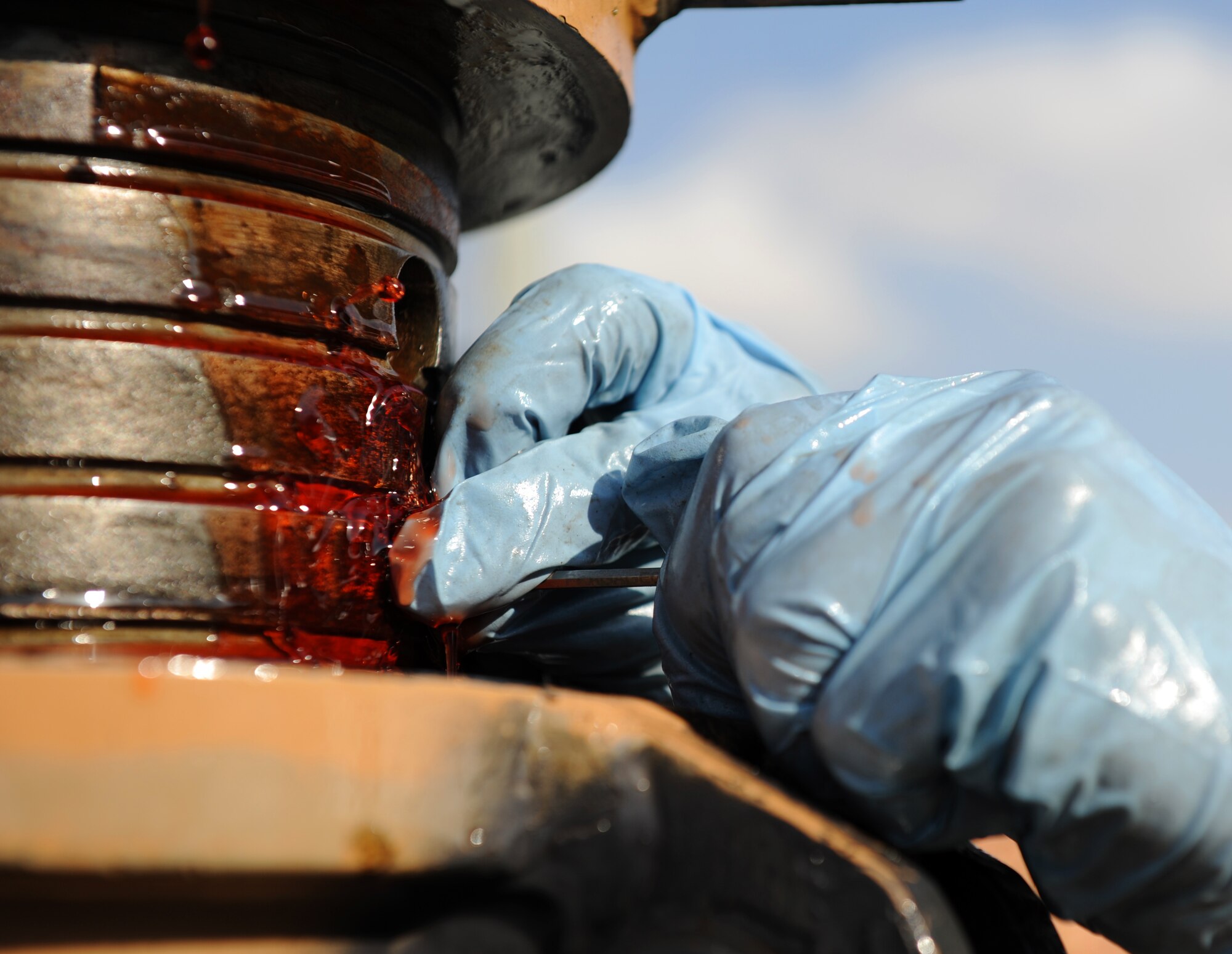 SOUTHWEST ASIA – Staff Sgt. Brian Van Stee, 379th Expeditionary Maintenance Squadron aerospace ground equipment mechanic and native of Cheyenne, Wyo., opens a valve to bleed air from a ram during routine maintenance on a 60-ton tripod jack here Dec. 21, 2011. The 60-ton tripod jack is used on the flightline to lift aircraft during maintenance. Van Stee is deployed from Robins Air Force Base, Ga. (U.S. Air Force photo/Staff Sgt. Nathanael Callon)