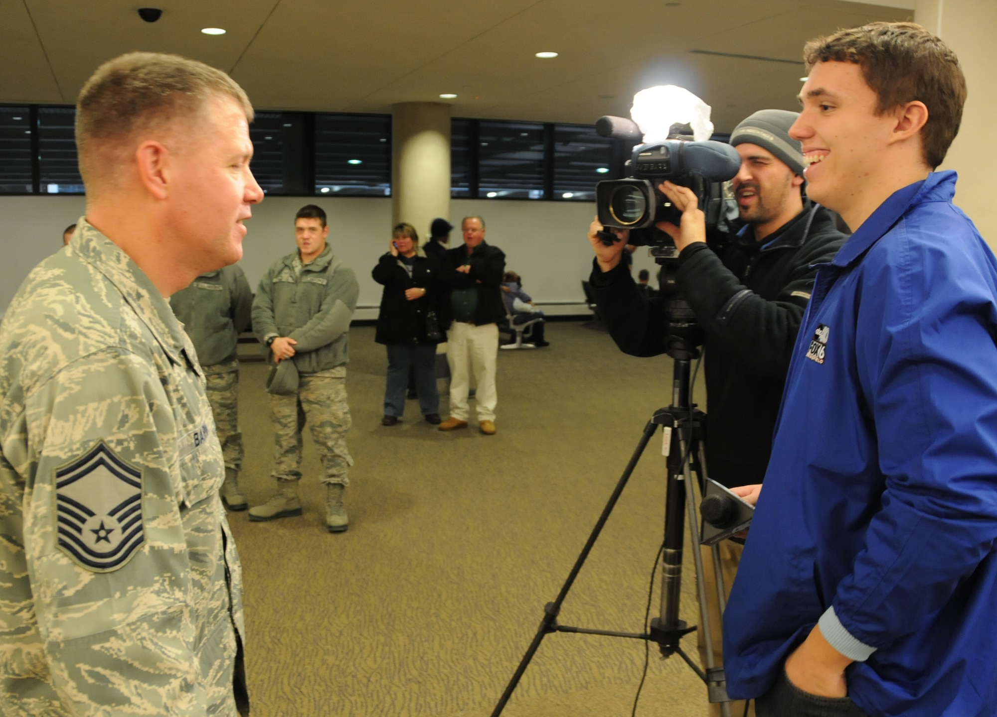 SMSgt. Michael Barna talks with a Springfield ABC 40 news crew about his experiences in Iraq, Dec. 21, at Bradley International Airport.