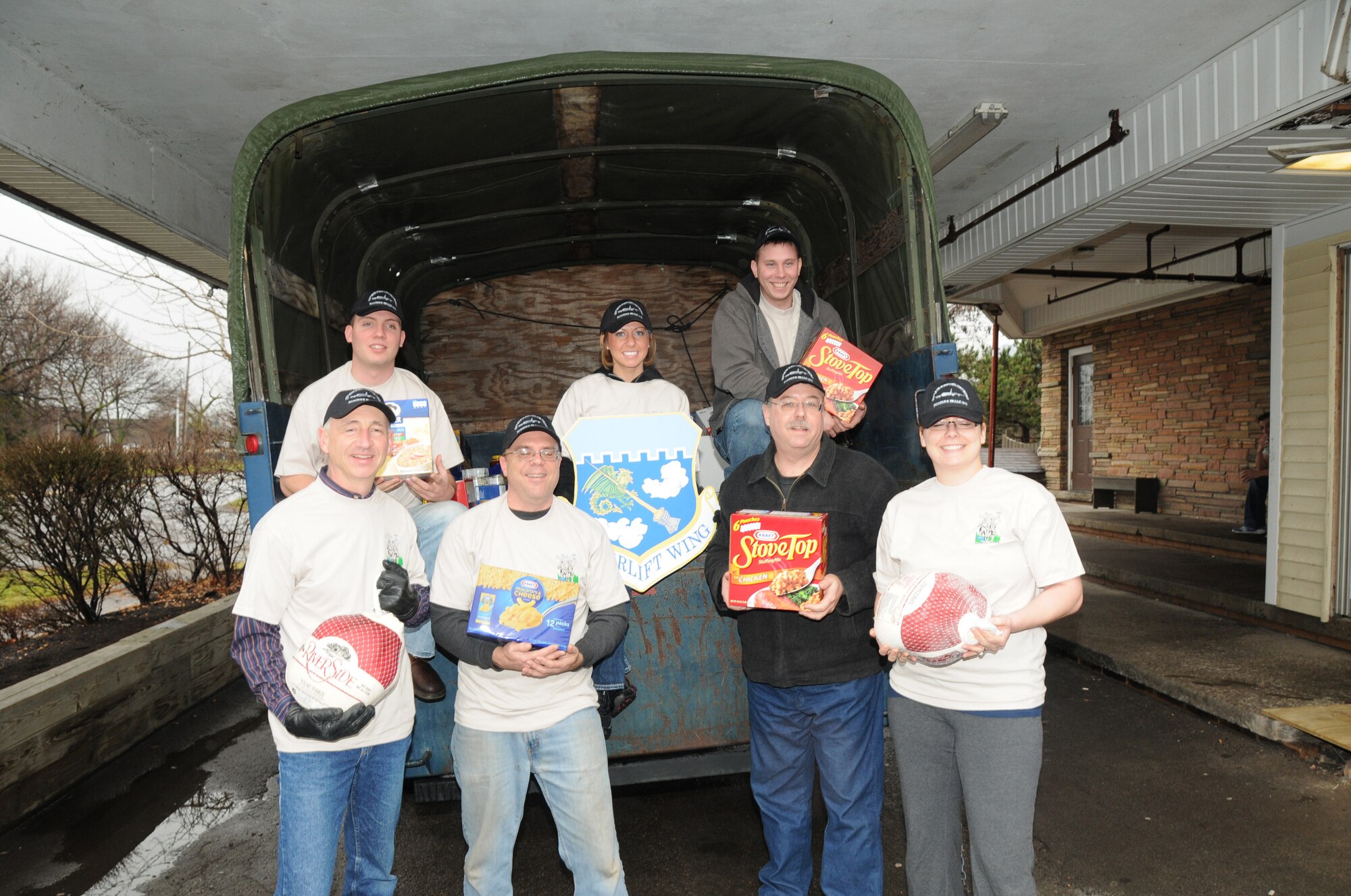 Airmen from the 107th Airlift Wing along with mission staff unloaded boxes of food, canned goods and frozen turkeys stocking up the food pantry at the Niagara Falls Community Mission. Front row; Master Sgt. Steven Buja, Tech. Sgt. Paul Wiegand, Master Sgt. Mark Lewandowski, Tech. Sgt. Amanda Doherty. Back row; Senior Airman Robert Kurzdorfer, Tech. Sgt. Krystatore Stegner and Airman 1st Class Tony Lewandowski. Front row; Master Sgt. Steven Buja, Tech. Sgt. Paul Wiegand, Master Sgt. Mark Lewandowski, Tech. Sgt. Amanda Doherty. Back row; Senior Airman Robert Kurzdorfer, Tech. Sgt. Krystatore Stegner and Airman 1st Class Tony Lewandowski. on December 21, 2011 (Air Force Photo/Senior Master Sgt Ray Lloyd)

