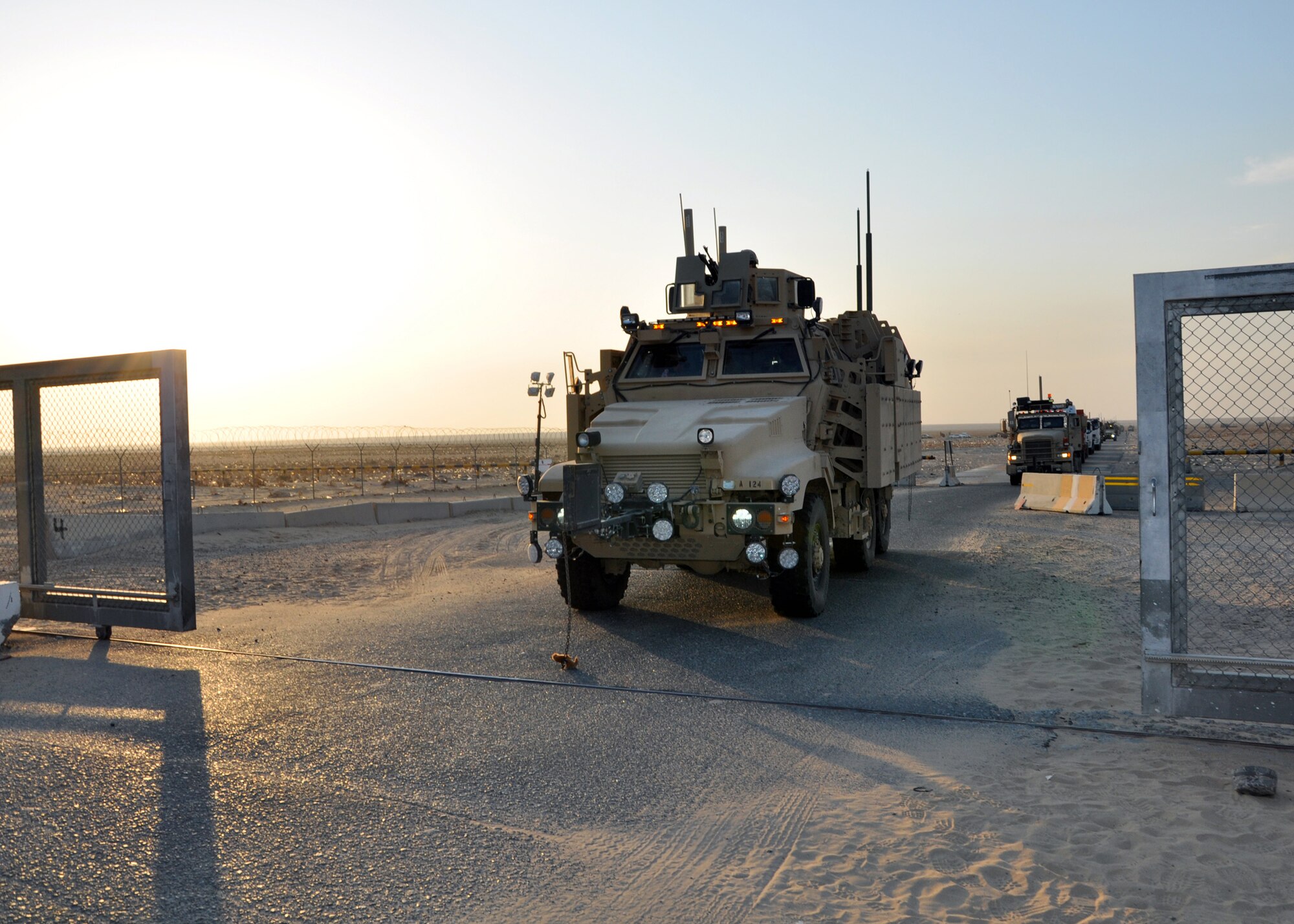 The last convoy of the 387th Expeditionary Logistics Readiness Squadron's "Convoy Truckers" passes through the border, leaving Iraq for the last time Dec. 17, 2011.  More than 3 million tons of cargo have been transported into and out of Iraq during Iraqi operations by the Airmen in the 387th ELRS. (U.S. Air Force photo/Tech. Sgt. Stacy Fowler)