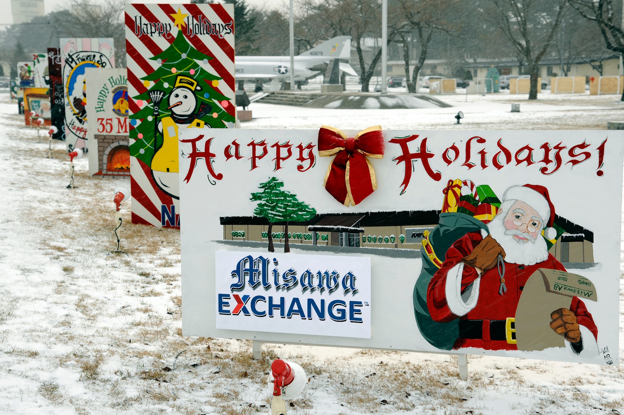 MISAWA AIR BASE, Japan - Holiday greeting cards line the street along Risner Circle here, Dec. 16. The first place winner of this year's holiday greeting card contest is the 35th Civil Engineer Squadron.  Second place is the Navy Public Works Department, and the third place is the 35th Medical Operations Squadron. (U.S. Air Force photo/Tech. Sgt. Marie Brown)