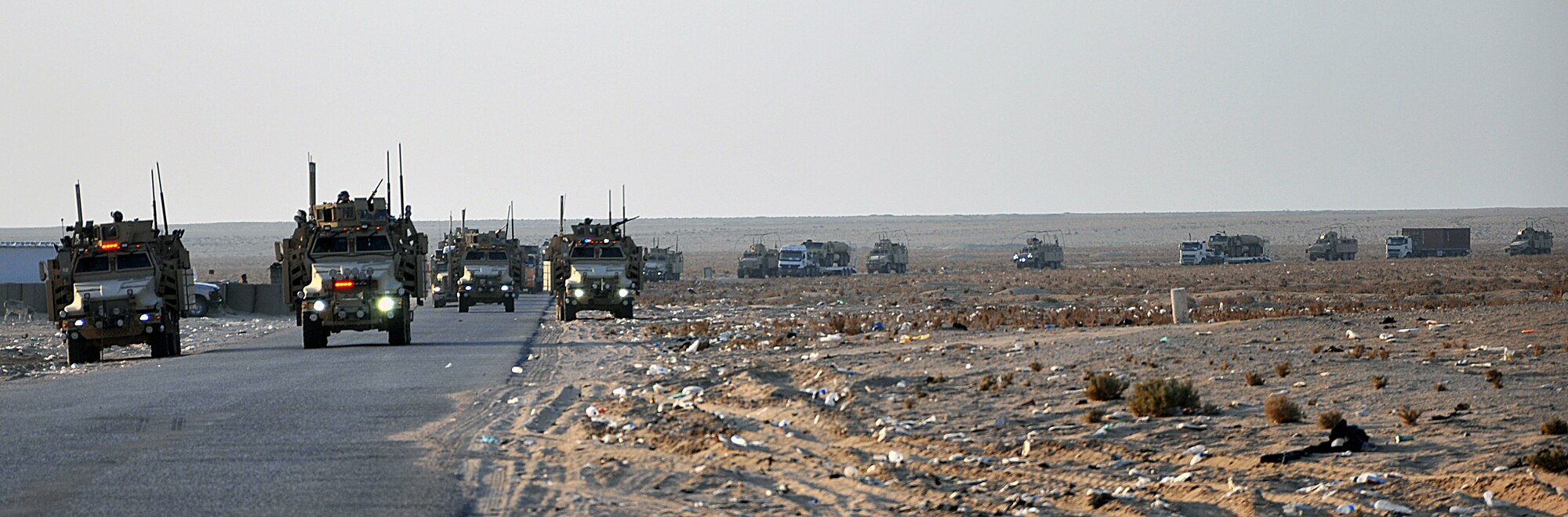 The last convoy of the 387th Expeditionary Logistics Readiness Squadron's "Convoy Truckers" leaves Iraq for the last time Dec. 17, 2011.  The drawdown of forces, which includes transporting the excess equipment from formerly-bustling bases within country, has kept the Airmen of the 387th ELRS on the road almost every day for the latter half of 2011. (U.S. Air Force photo/Tech. Sgt. Stacy Fowler)