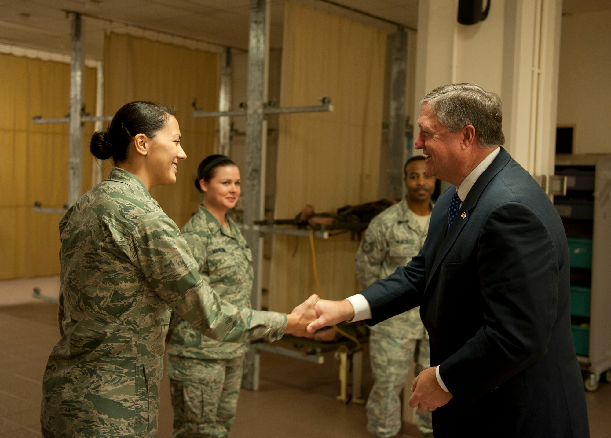 Capt. Linda Bradshaw, 39th Medical Operations Squadron, greets Secretary of the Air Force Michael Donley during his tour of the Medical Clinic Dec. 20, 2011, at Incirlik Air Base, Turkey. During his visit, Donley met with Airmen across the base to personally thank them for their service. (U.S. Air Force photo by Senior Airman Clayton Lenhardt/Released)
