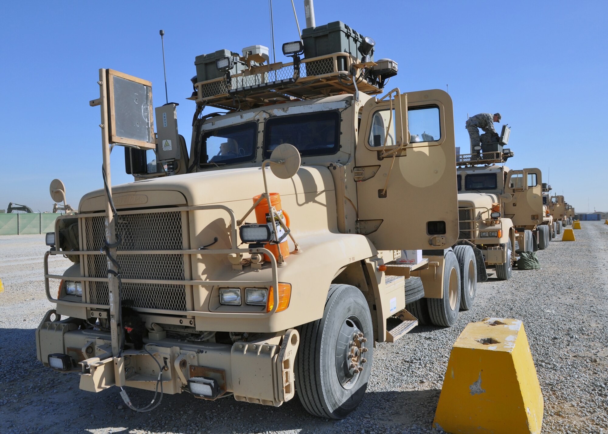 Airmen with the 387th Expeditionary Logistics Readiness Squadron prepare their trucks for the last convoy into Iraq Dec. 14, 2011.  The 387th ELRS "Combat Truckers" have been transporting U.S. equipment out of Iraq for months, preparing for the final drawdown which is scheduled to be complete by Dec. 31, 2011. (U.S. Air Force photo/Tech. Sgt. Stacy Fowler)