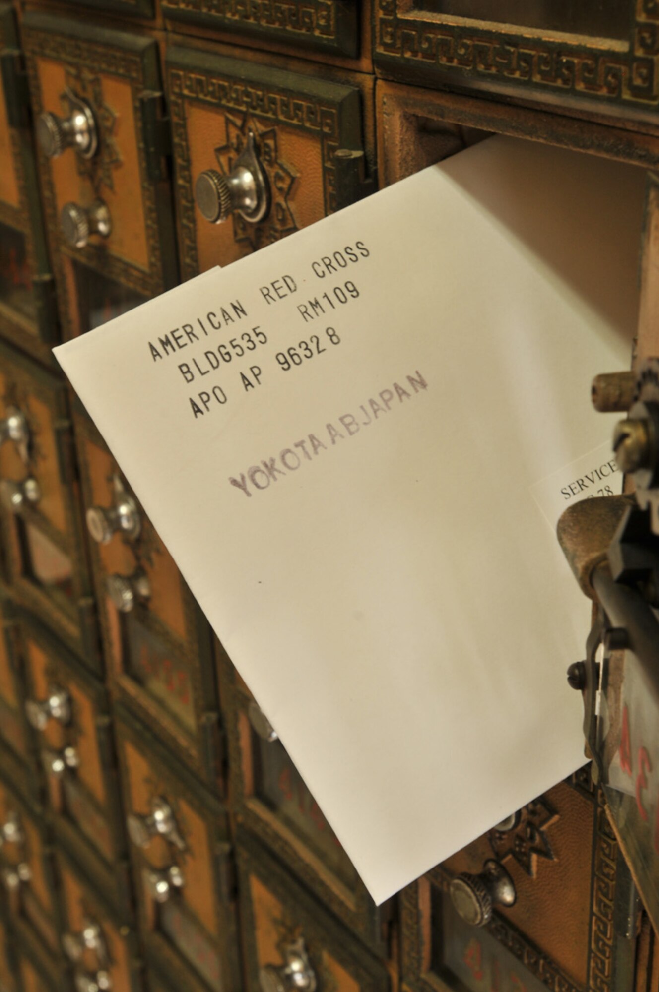 YOKOTA AIR BASE, Japan -- A holiday greeting card sits in a service member's mail box at Yokota Air Base, Japan, Dec. 22, 2011. The card is one of 7,000 being distributed to service members here and at Camp Fuji, Japan, through the American Red Cross. Cards were sent to the ARC through the Holiday Mail for Heroes program. (U.S. Air Force photo/Airman 1st Class Desiree Economides)