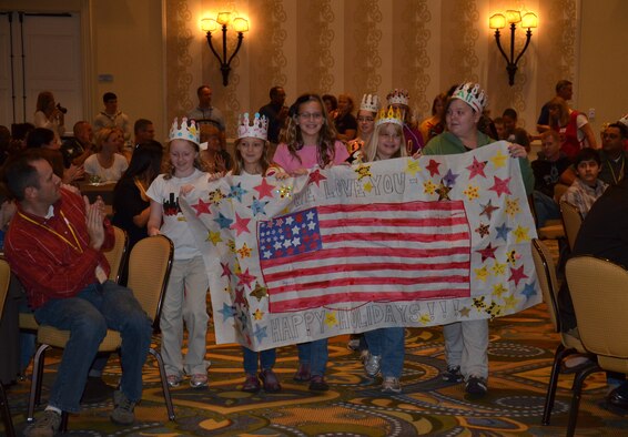Air Force Reserve-dependent children showcase a banner and their arts and crafts during a mini parade Dec. 18, 2011 at Air Force Reserve Command’s Yellow Ribbon event in Orlando, Fla. Yellow Ribbon is specifically tailored for Reservists and their families to learn about pre- and post-deployment benefits, network with other Reserve families from across the nation, and get the support they need through all phases of deployment. (U.S. Air Force photo/Staff Sgt. Anna-Marie Wyant)