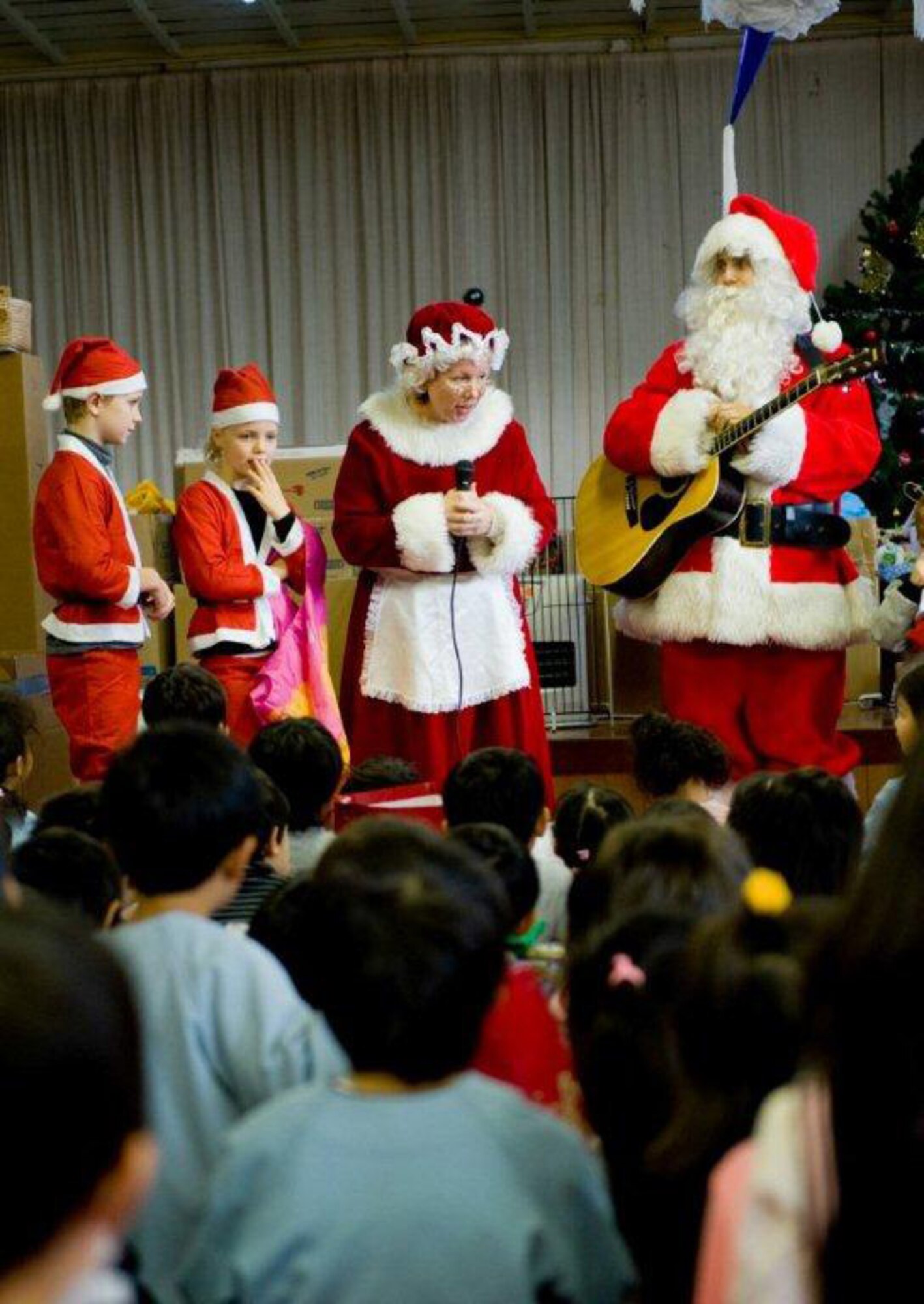 MIYAGI-KEN, Japan -- Santa, Mrs. Claus and their helpers, all from U.S. Forces Japan, bring holiday greetings to children at Fuji Kindergarten, Dec. 15, 2011. More than 25 Yokota members visited the kindergarten, which was largely affected by the 9.0-magnitude earthquake and subsequent tsunami on March 11, 2011. (U.S. Air Force photo/Airman 1st Class Krystal Garrett)