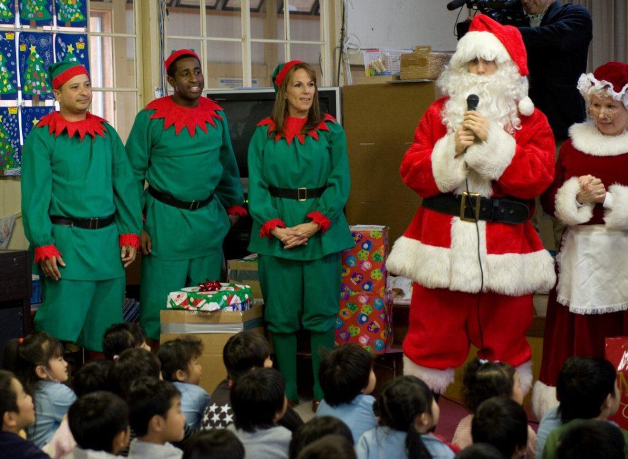 MIYAGI-KEN, Japan -- Santa, Mrs. Claus and their helpers, all from U.S. Forces Japan, bring presents and holiday cheer to Fuji Kindergarten in northern Japan, Dec. 15, 2011. More than 25 Yokota members visited the kindergarten, which was largely affected by the 9.0-magnitude earthquake and subsequent tsunami on March 11, 2011. (U.S. Air Force photo/Airman 1st Class Krystal Garrett)