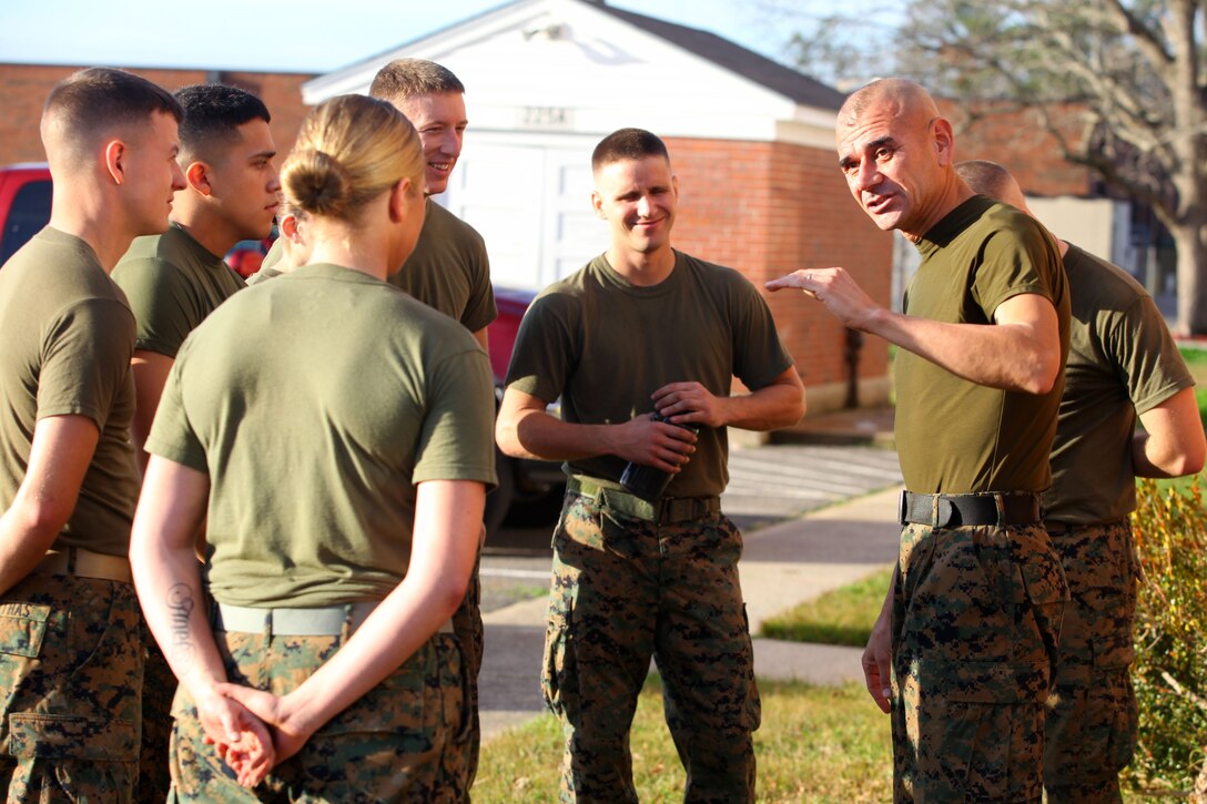 Sergeant Major Octaviano Gallegos, the 24 th Marine Expeditionary Unit’s sergeant major talks to Marines with the Command Element, 24th MEU participating in a meritorious corporal and sergeant promotion board Dec. 20, 2011, outside the 24th MEU’s headquarters building aboard Camp Lejeune, N.C. The Marines were evaluated on various Marine Corps-centric activities, such as uniform inspections, Marine Corps knowledge tests, combat fitness training, and drill.